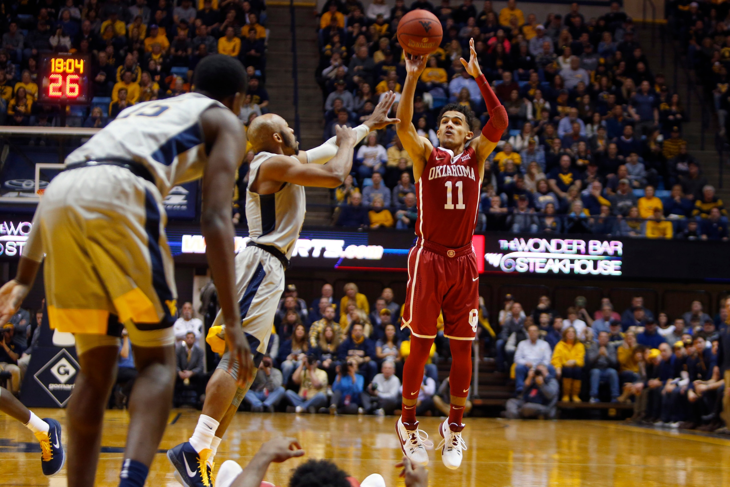 MORGANTOWN, WV - JANUARY 06:  Trae Young #11 of the Oklahoma Sooners pulls up for three against the West Virginia Mountaineers at the WVU Coliseum on January 6, 2018 in Morgantown, West Virginia.  (Photo by Justin K. Aller/Getty Images)