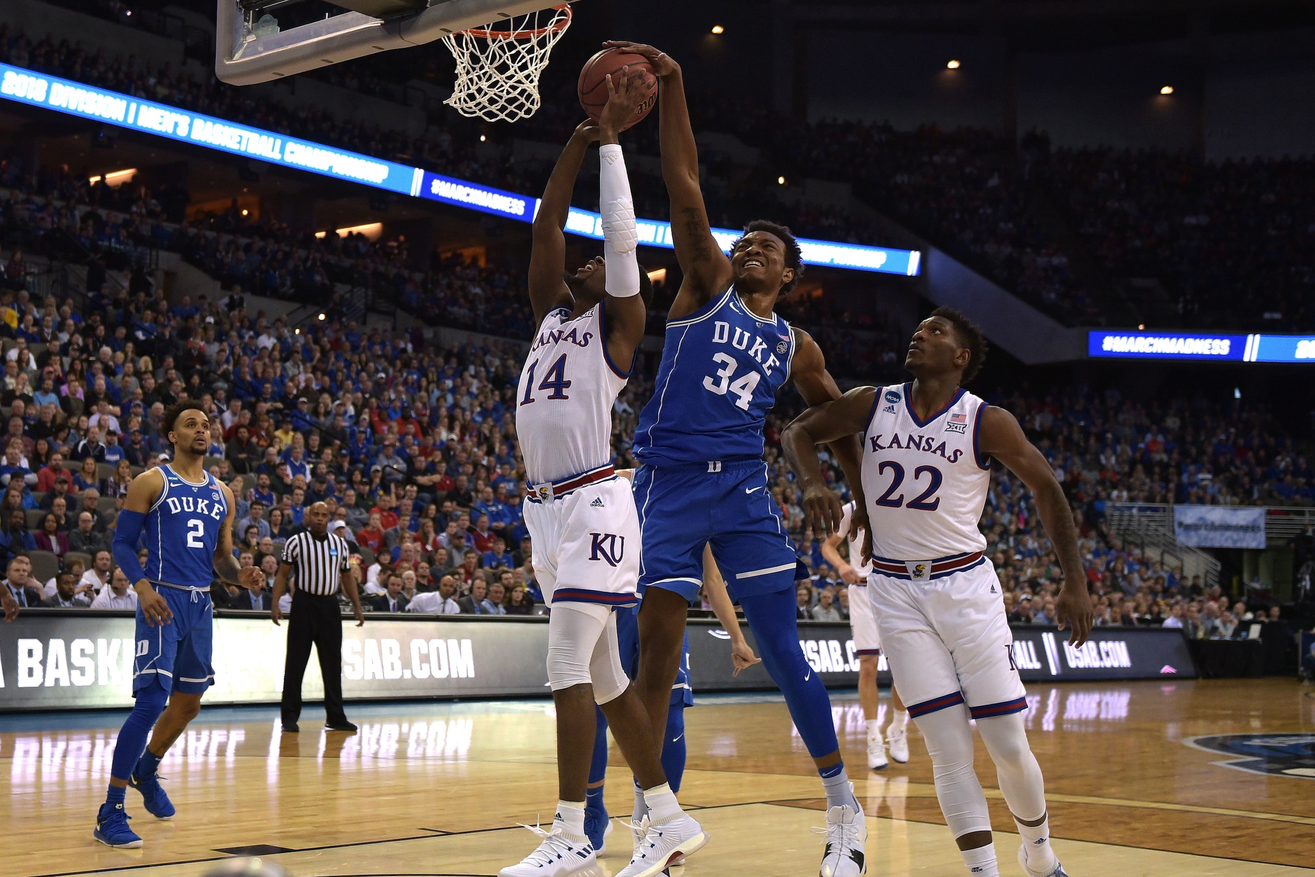 OMAHA, NE - MARCH 25: Wendell Carter, Jr. #34 of the Duke Blue Devils blocks a shot by Malik Newman #14 of the Kansas Jayhawks during the 2018 NCAA Men's Basketball Tournament Midwest Regional Final at CenturyLink Center on March 25, 2018 in Omaha, Nebras