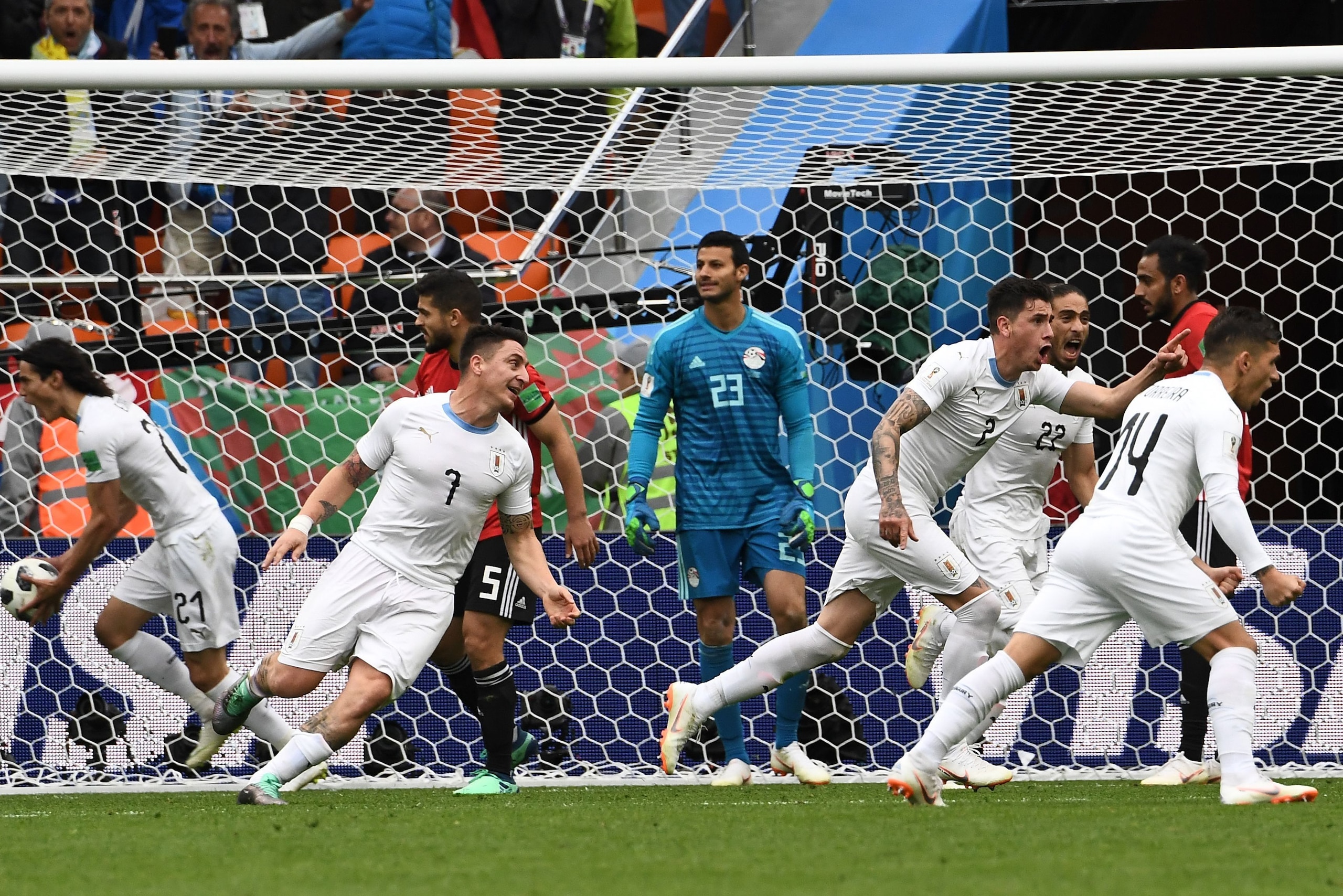 Uruguay's defender Jose Gimenez (C) celebrates scoring the opening goal during the Russia 2018 World Cup Group A football match between Egypt and Uruguay at the Ekaterinburg Arena in Ekaterinburg on June 15, 2018. (Photo by Anne-Christine POUJOULAT / AFP)