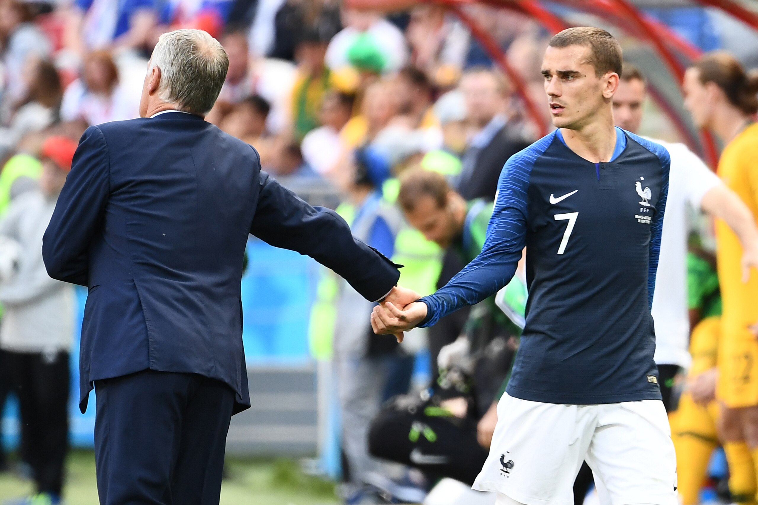 France's coach Didier Deschamps (L) takes France's forward Antoine Griezmann's hand during the Russia 2018 World Cup Group C football match between France and Australia at the Kazan Arena in Kazan on June 16, 2018. (Photo by FRANCK FIFE / AFP) / RESTRICTE