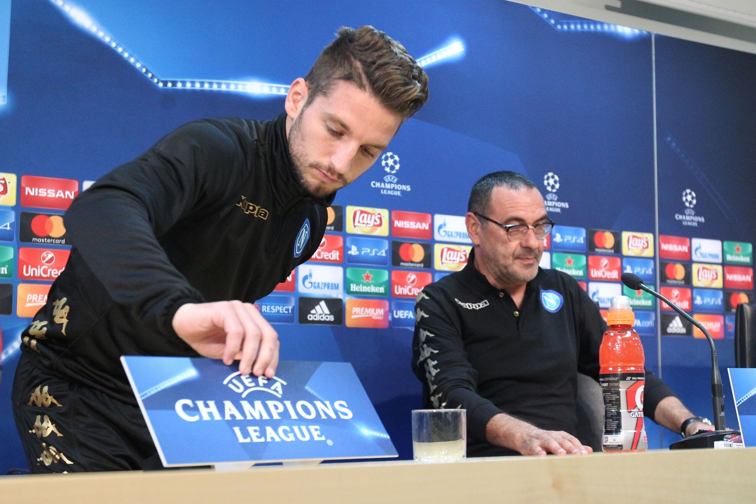 Napoli's forward from Belgium Dries Mertens (L) and Napoli's coach from Italy Maurizio Sarri arrive to give a press conference on the eve of the UEFA Champions League football match SSC Napoli vs FK Dynamo Kiev on November 22, 2016 at the SSC Napoli headq