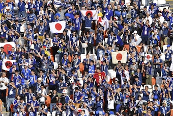 Japan's fans celebrate their 2-1 victory at the end of the Russia 2018 World Cup Group H football match between Colombia and Japan at the Mordovia Arena in Saransk on June 19, 2018. (Photo by Mladen ANTONOV / AFP) / RESTRICTED TO EDITORIAL USE - NO MOBILE