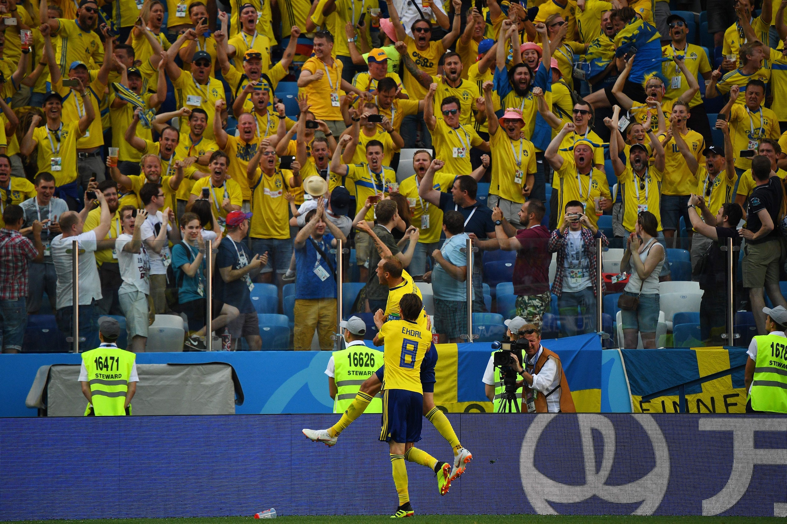 Sweden's defender Andreas Granqvist (top) celebrates after scoring a penalty during the Russia 2018 World Cup Group F football match between Sweden and South Korea at the Nizhny Novgorod Stadium in Nizhny Novgorod on June 18, 2018. (Photo by Johannes EISE