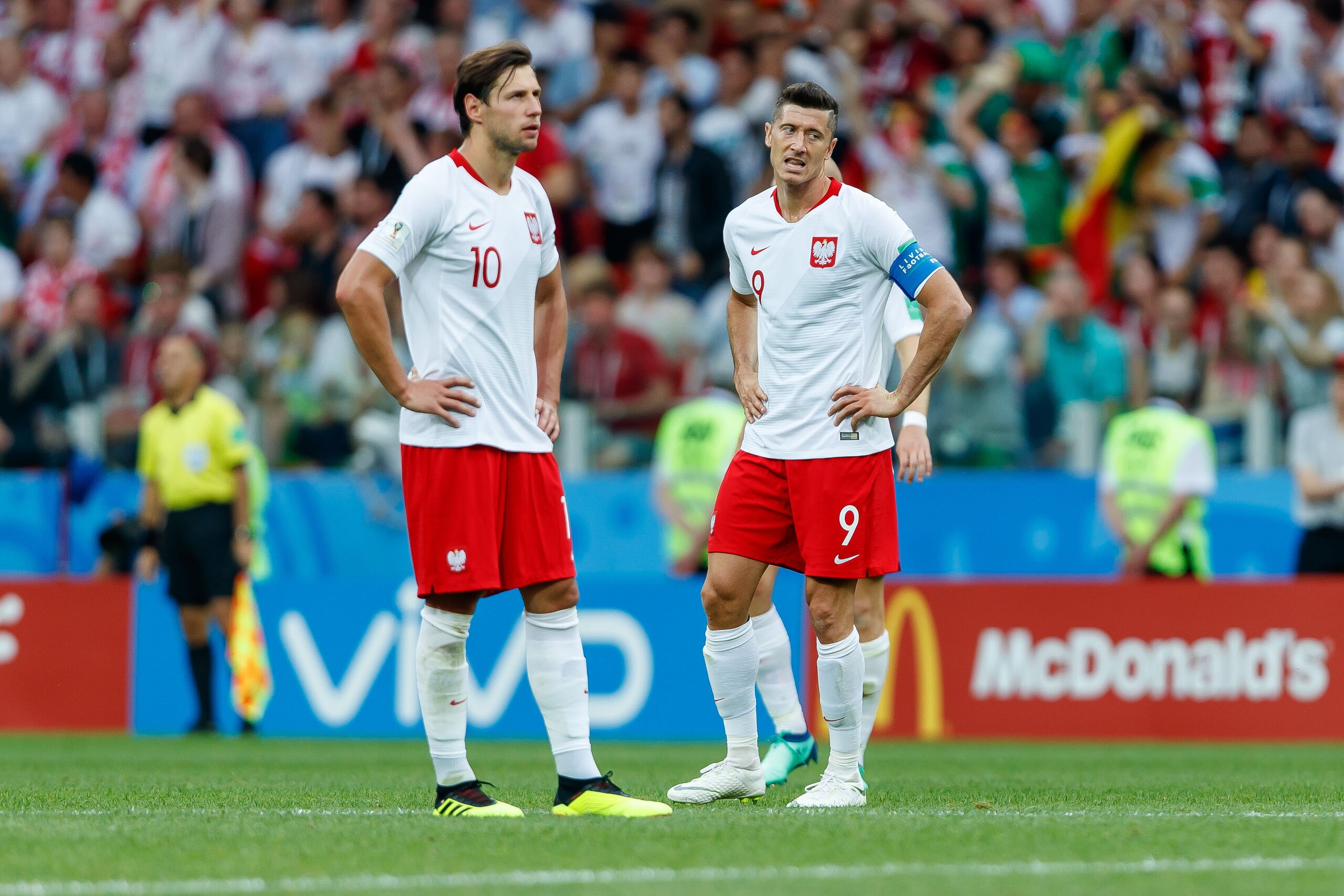 MOSCOW, RUSSIA - JUNE 19: Grzegorz Krychowiak of Poland and Robert Lewandowski of Poland look on during the 2018 FIFA World Cup Russia group H match between Poland and Senegal at Spartak Stadium on June 19, 2018 in Moscow, Russia. (Photo by TF-Images/Gett