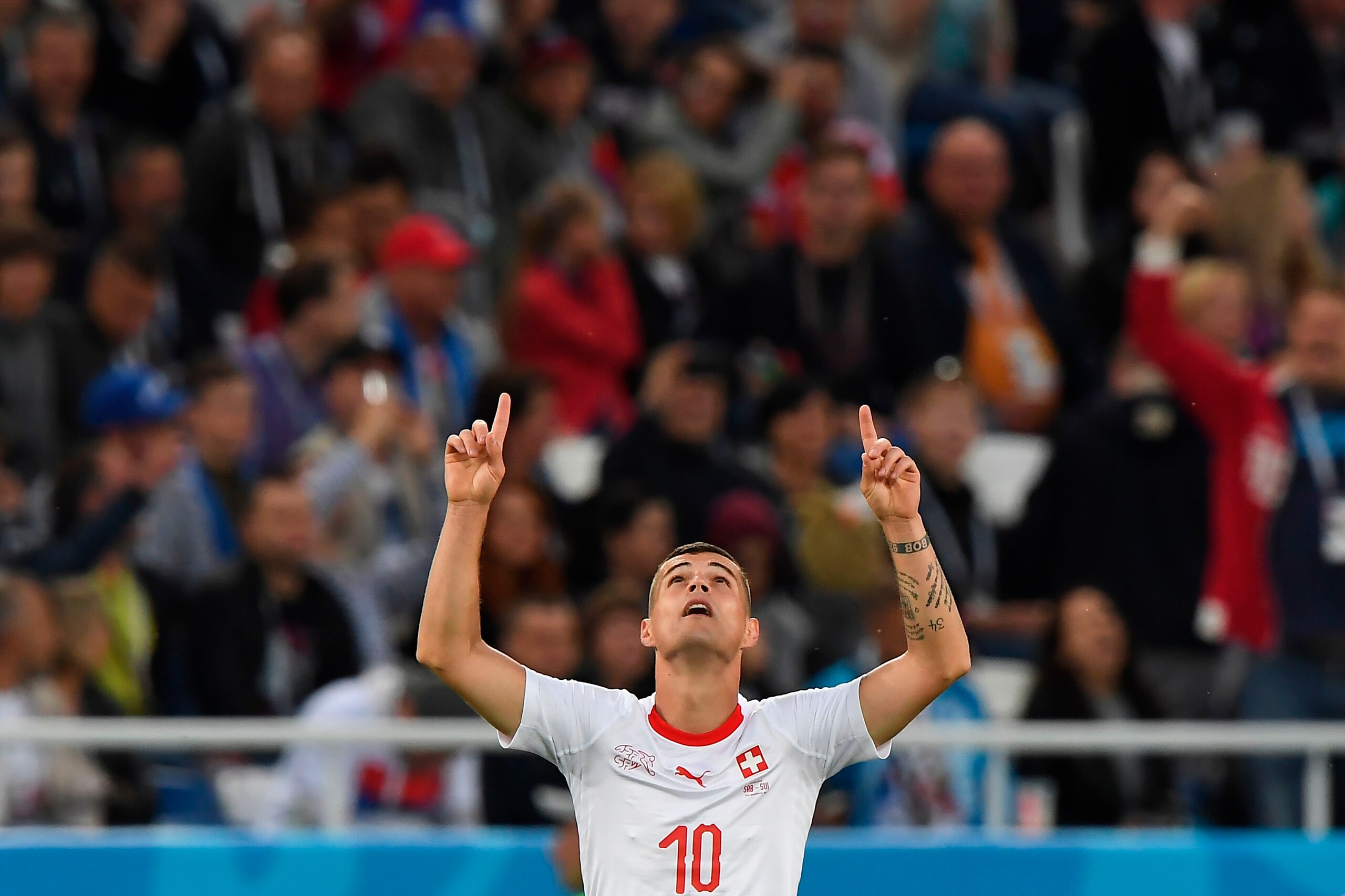 Switzerland's midfielder Granit Xhaka celebrates scoring during their Russia 2018 World Cup Group E football match between Serbia and Switzerland at the Kaliningrad Stadium in Kaliningrad on June 22, 2018. (Photo by Attila KISBENEDEK / AFP) / RESTRICTED T