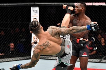SINGAPORE - JUNE 23:  (L-R) Tyson Pedro of Australia  kicks Ovince Saint Preux in their light heavyweight bout during the UFC Fight Night event at the Singapore Indoor Stadium on June 23, 2018 in Singapore. (Photo by Jeff Bottari/Zuffa LLC/Zuffa LLC via G