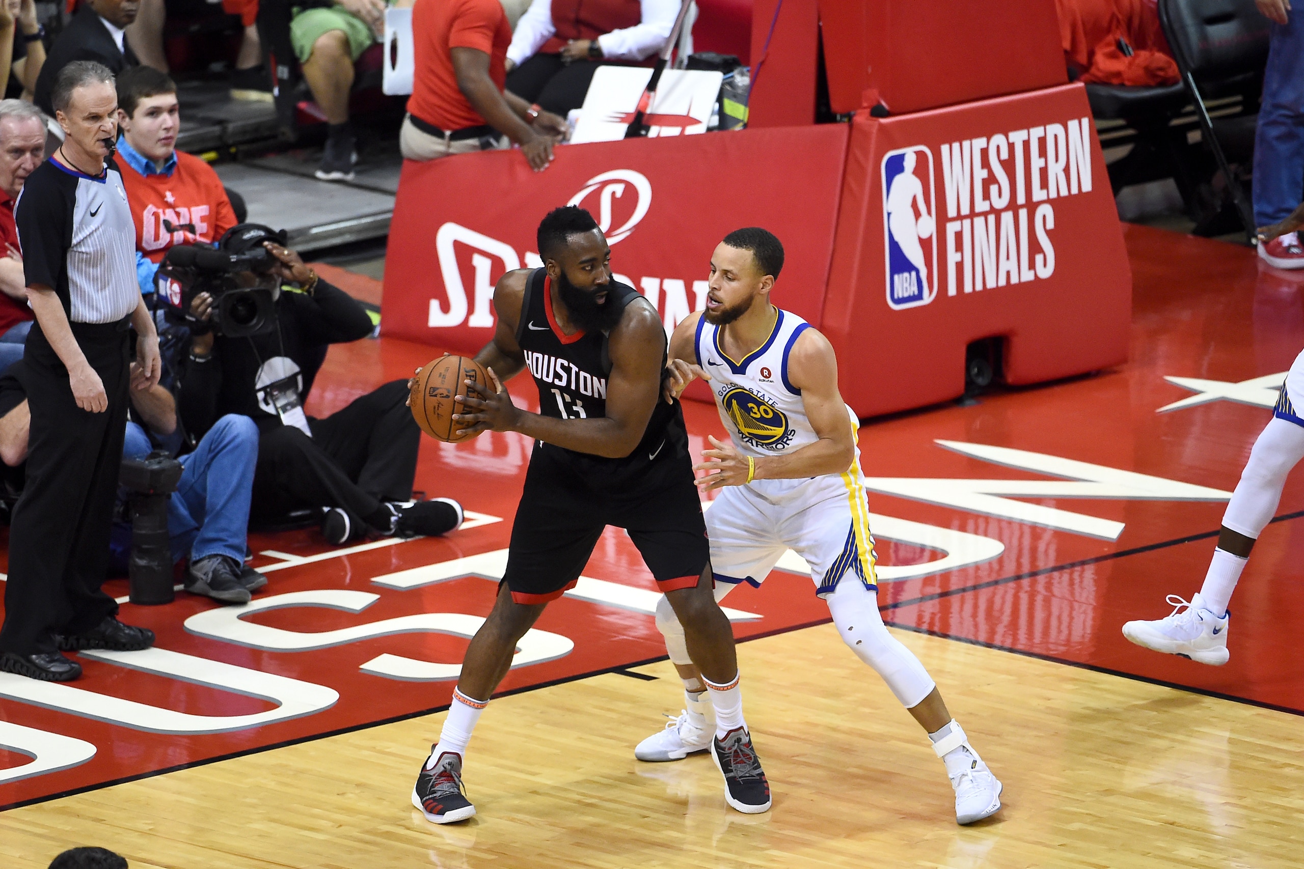 HOUSTON, TX - MAY 28: James Harden #13 of the Houston Rockets handles the ball against Stephen Curry #30 of the Golden State Warriors in Game Seven of the Western Conference Finals during the 2018 NBA Playoffs on May 28, 2018 at the Toyota Center in Houst
