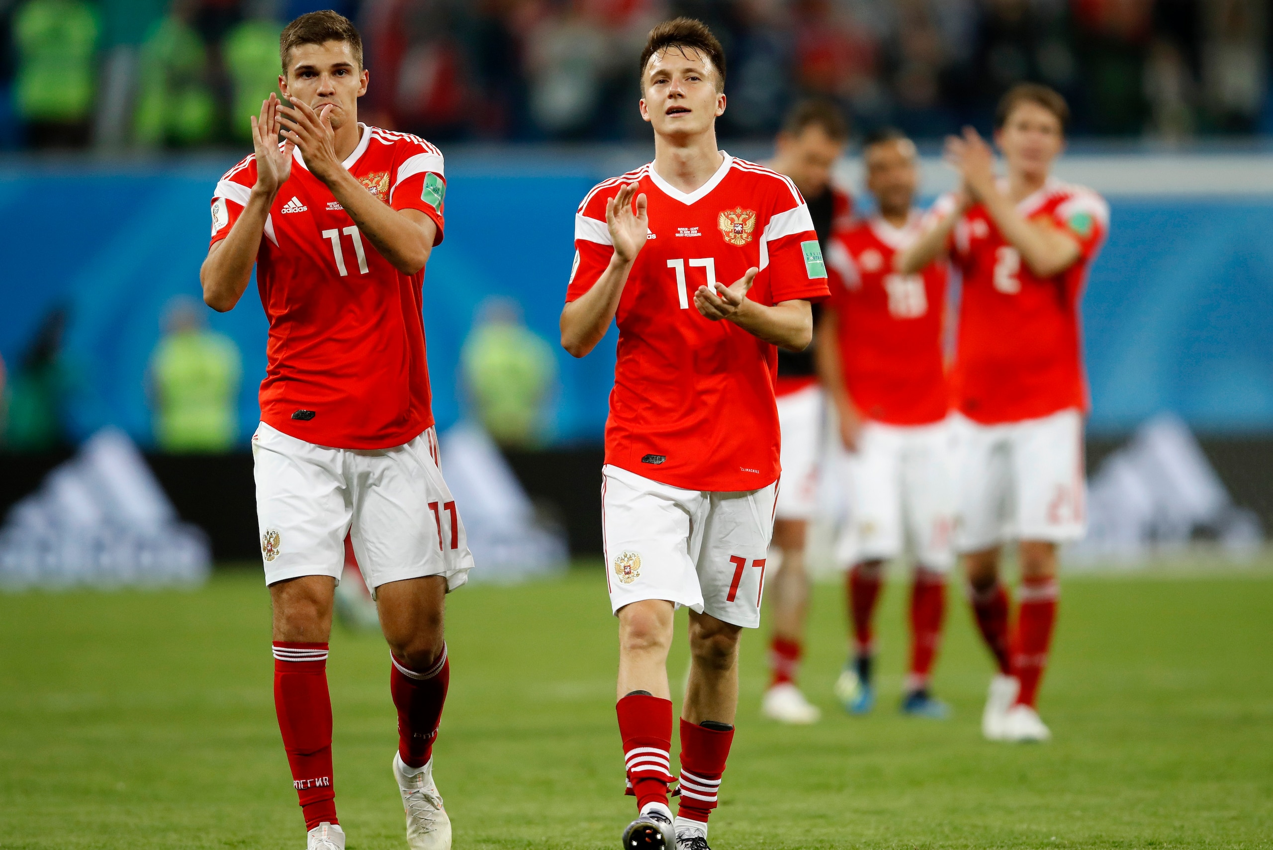 SAINT PETERSBURG, RUSSIA - JUNE 19: Roman Zobnin of Russia and Aleksandr Golovin of Russia applauds fans after their sides victory in the 2018 FIFA World Cup Russia group A match between Russia and Egypt at Saint Petersburg Stadium on June 19, 2018 in Sa SAINT PETERSBURG, RUSSIA - JUNE 19: Roman Zobnin of Russia and Aleksandr Golovin of Russia applauds fans after their sides victory in the 2018 FIFA World Cup Russia group A match between Russia and Egypt at Saint Petersburg Stadium on June 19, 2018 in Sa