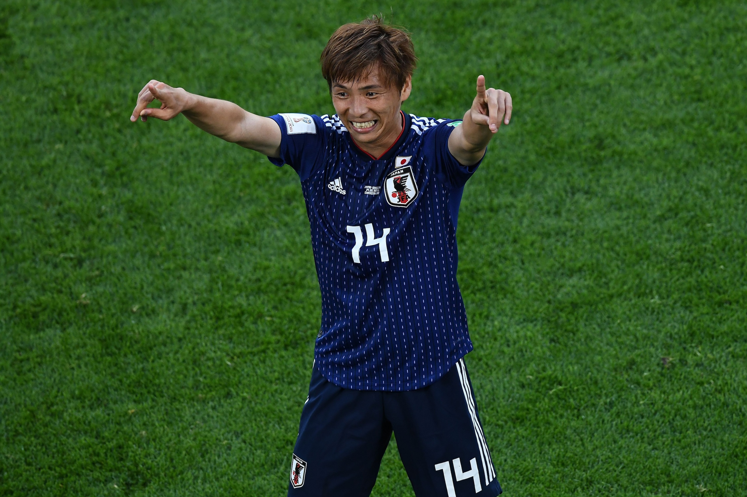 Japan's midfielder Takashi Inui celebrates a goal during the Russia 2018 World Cup Group H football match between Japan and Senegal at the Ekaterinburg Arena in Ekaterinburg on June 24, 2018. (Photo by Anne-Christine POUJOULAT / AFP) / RESTRICTED TO EDITO