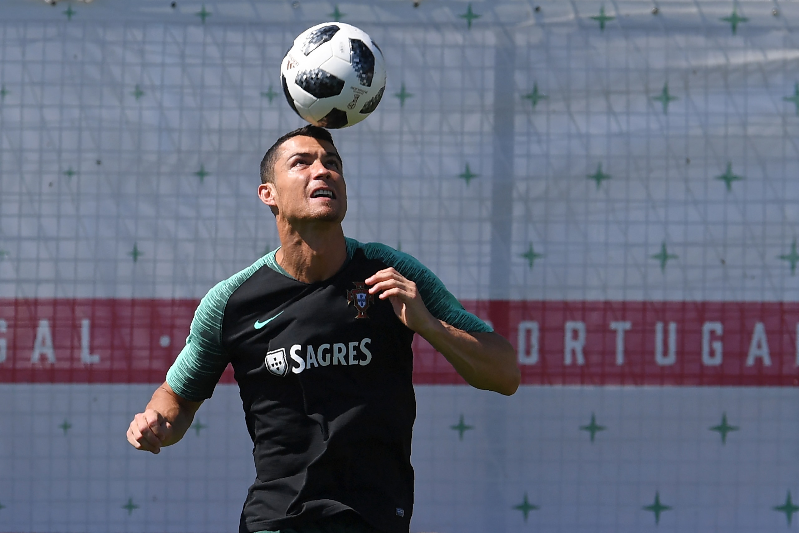 Portugal's forward Cristiano Ronaldo controls a ball during a training session at the team's base in Kratovo, outside Moscow, on June 22, 2018, during the Russia 2018 World Cup football tournament. (Photo by Francisco LEONG / AFP)        (Photo credit sho
