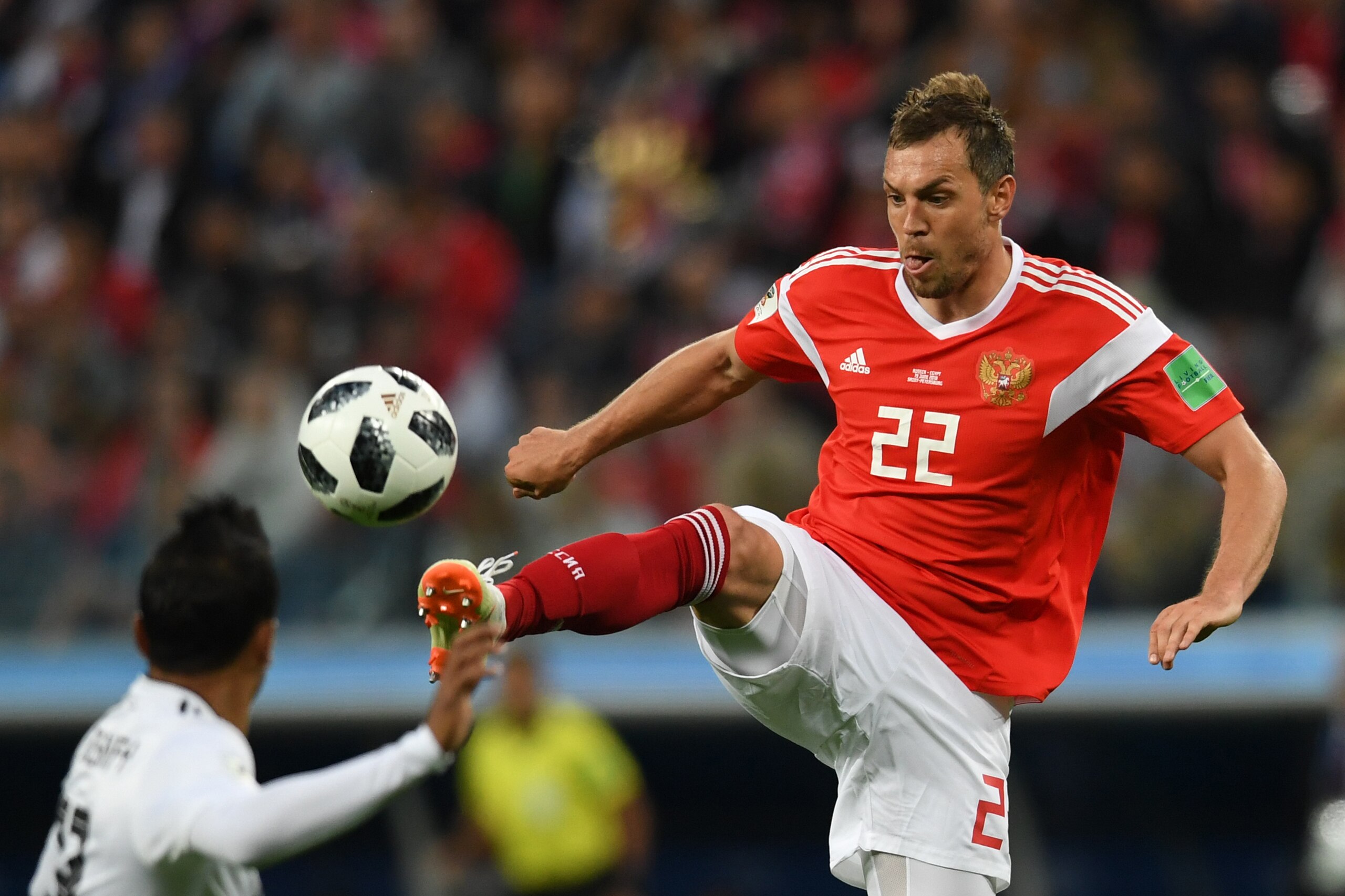 Russia's forward Artem Dzyuba (R) controls the ball during the Russia 2018 World Cup Group A football match between Russia and Egypt at the Saint Petersburg Stadium in Saint Petersburg on June 19, 2018. (Photo by Olga MALTSEVA / AFP) / RESTRICTED TO EDITO