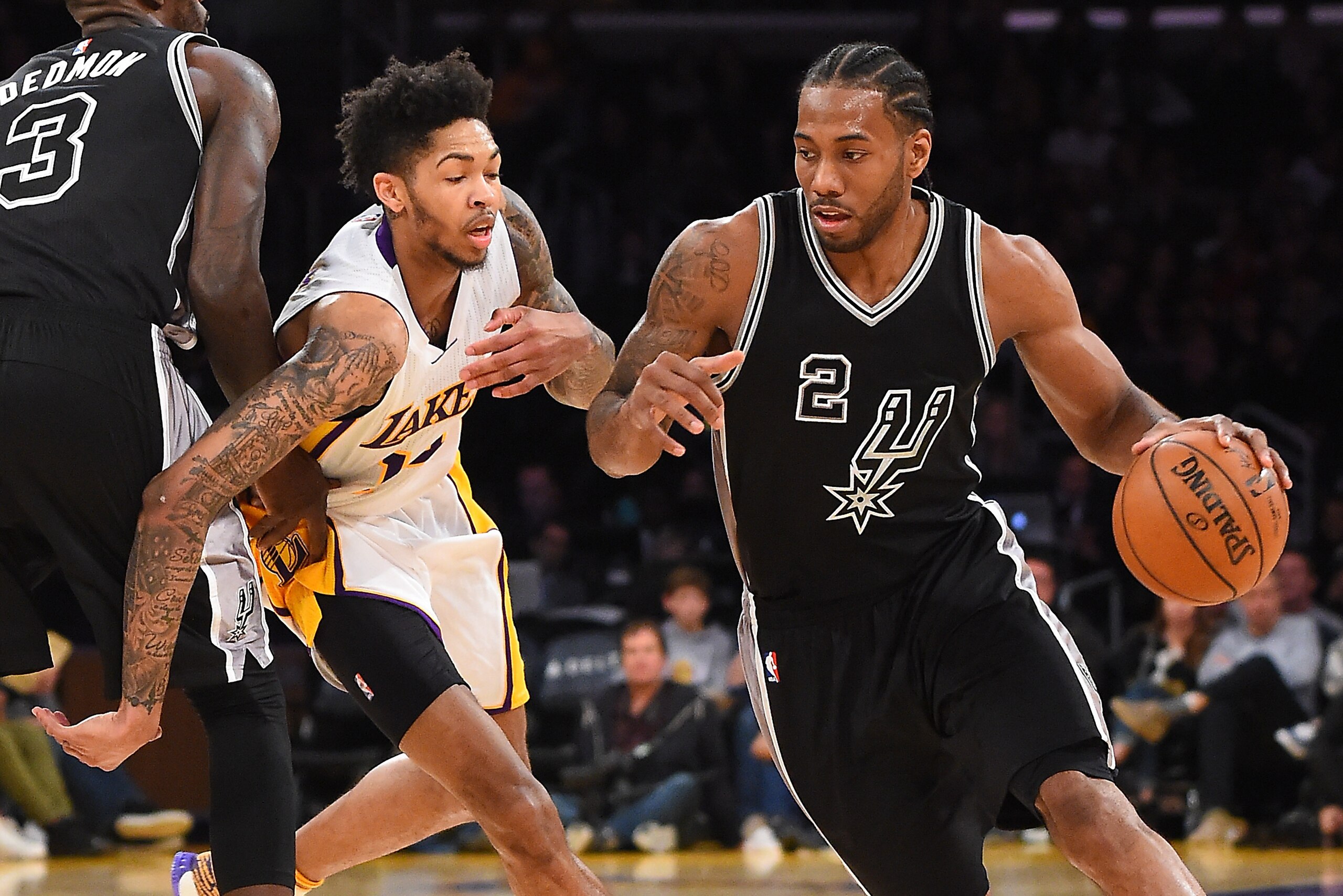 LOS ANGELES, CA - FEBRUARY 26:  Kawhi Leonard #2 of the San Antonio Spurs drives to the basket as he gets past Brandon Ingram #14 of the Los Angeles Lakers in the second half of the game at Staples Center on February 26, 2017 in Los Angeles, California. S