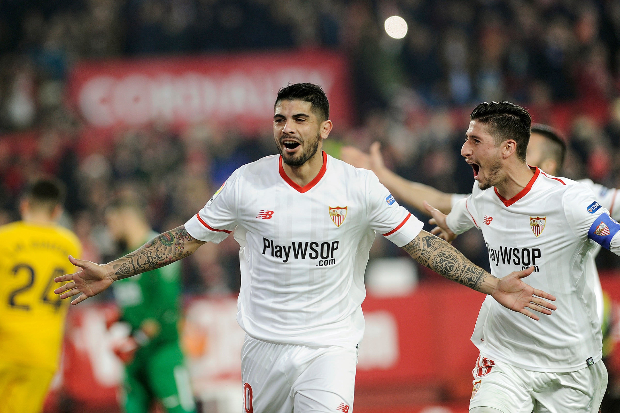 Sevilla's Argentinian midfielder Ever Banega (C) celebrates with teammates after scoring a goal during the Spanish 'Copa del Rey' (King's cup) quarter-final second leg football match between Sevilla FC and Club Atletico de Madrid at the Ramon Sanchez Pizj Sevilla's Argentinian midfielder Ever Banega (C) celebrates with teammates after scoring a goal during the Spanish 'Copa del Rey' (King's cup) quarter-final second leg football match between Sevilla FC and Club Atletico de Madrid at the Ramon Sanchez Pizj