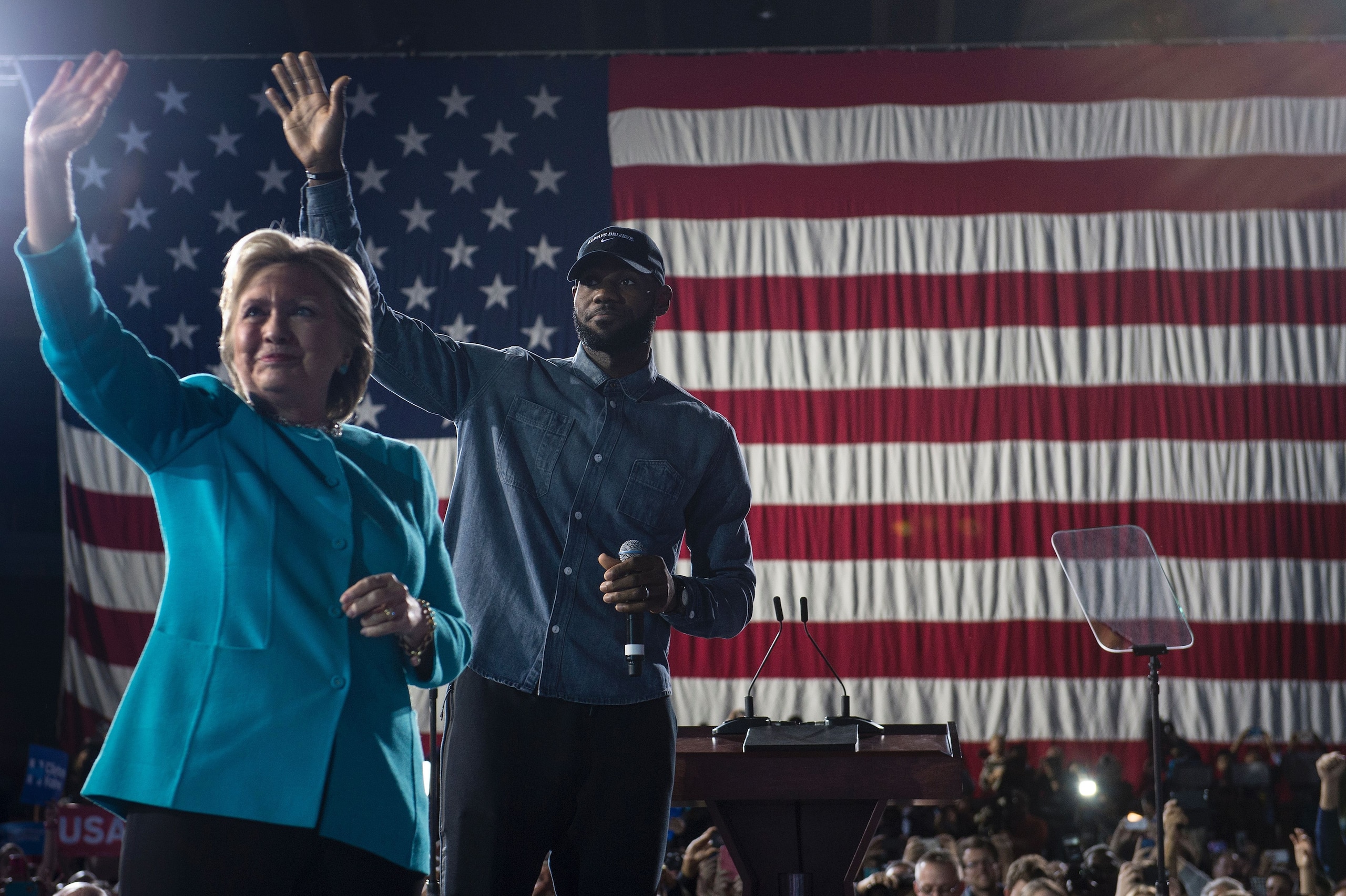 NBA basketball player Lebron James and Democratic presidential nominee Hillary Clinton arrive for a rally at the Cleveland Public Auditorium November 6, 2016 in Cleveland, Ohio.
Donald Trump barnstorms five states Sunday while Hillary Clinton implores her