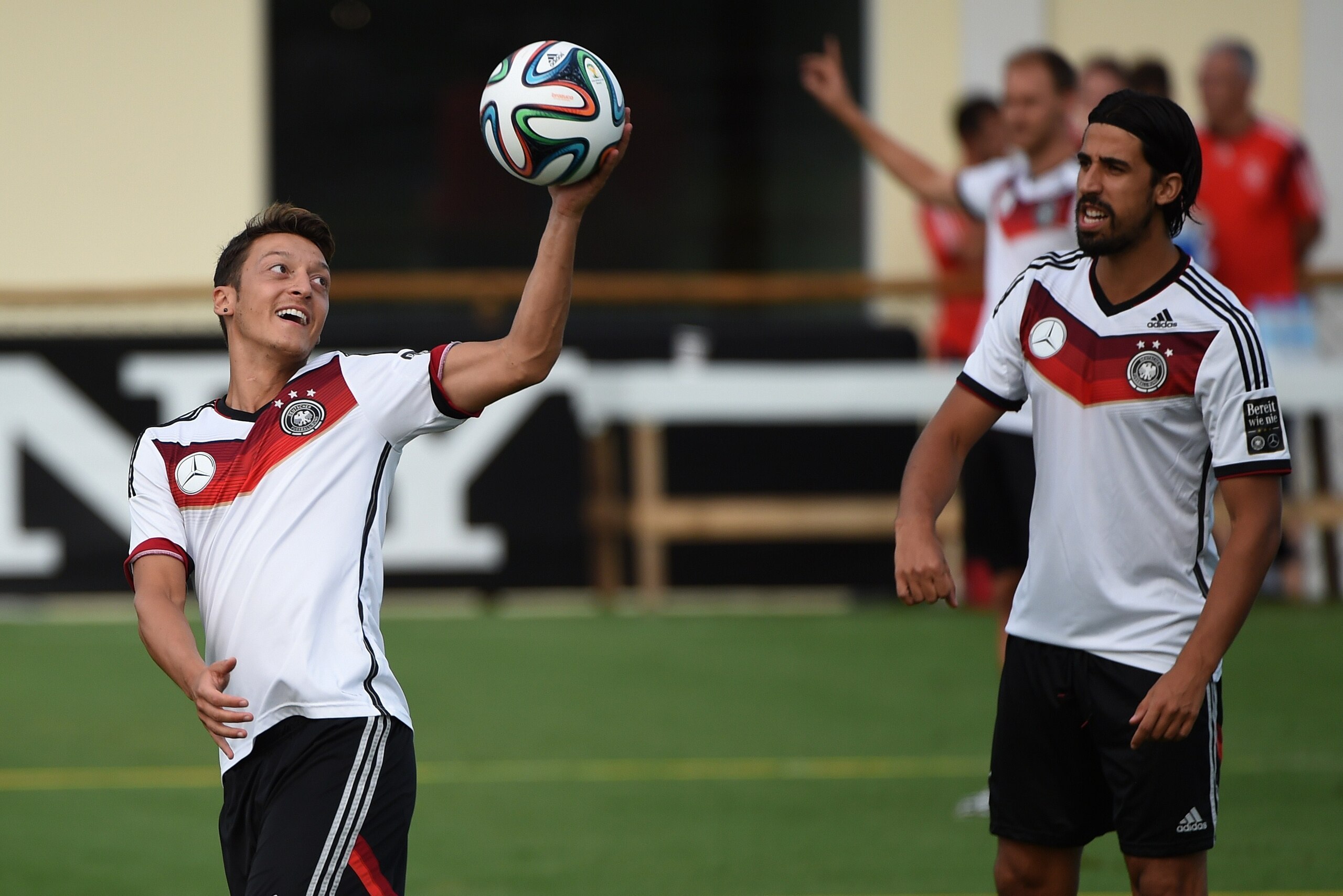 Germany's midfielder Mesut Ozil (L) and Germany's midfielder Sami Khedira warm up during a training session in Santo Andre on July 10, 2014, ahead of the final match Argentina vs Germany on July 13 during the 2014 FIFA World Cup football tournament. AFP P