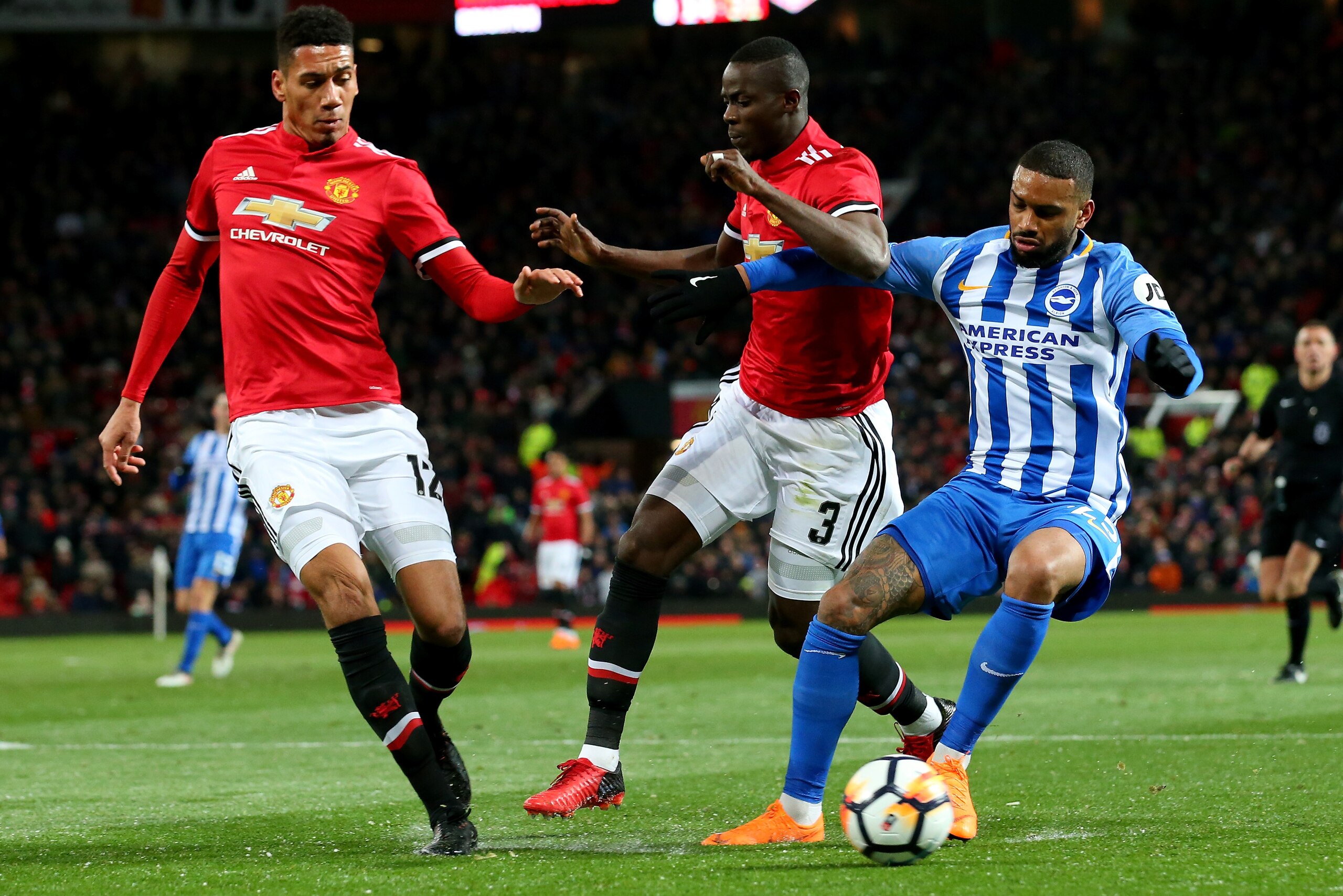 MANCHESTER, ENGLAND - MARCH 17:  Chris Smalling and Eric Bailly of Manchester United challenging Jurgen Locadia of Brighton during the Emirates FA Cup Quarter Final between Manchester United and Brighton & Hove Albion at Old Trafford on March 17, 2018 in 
