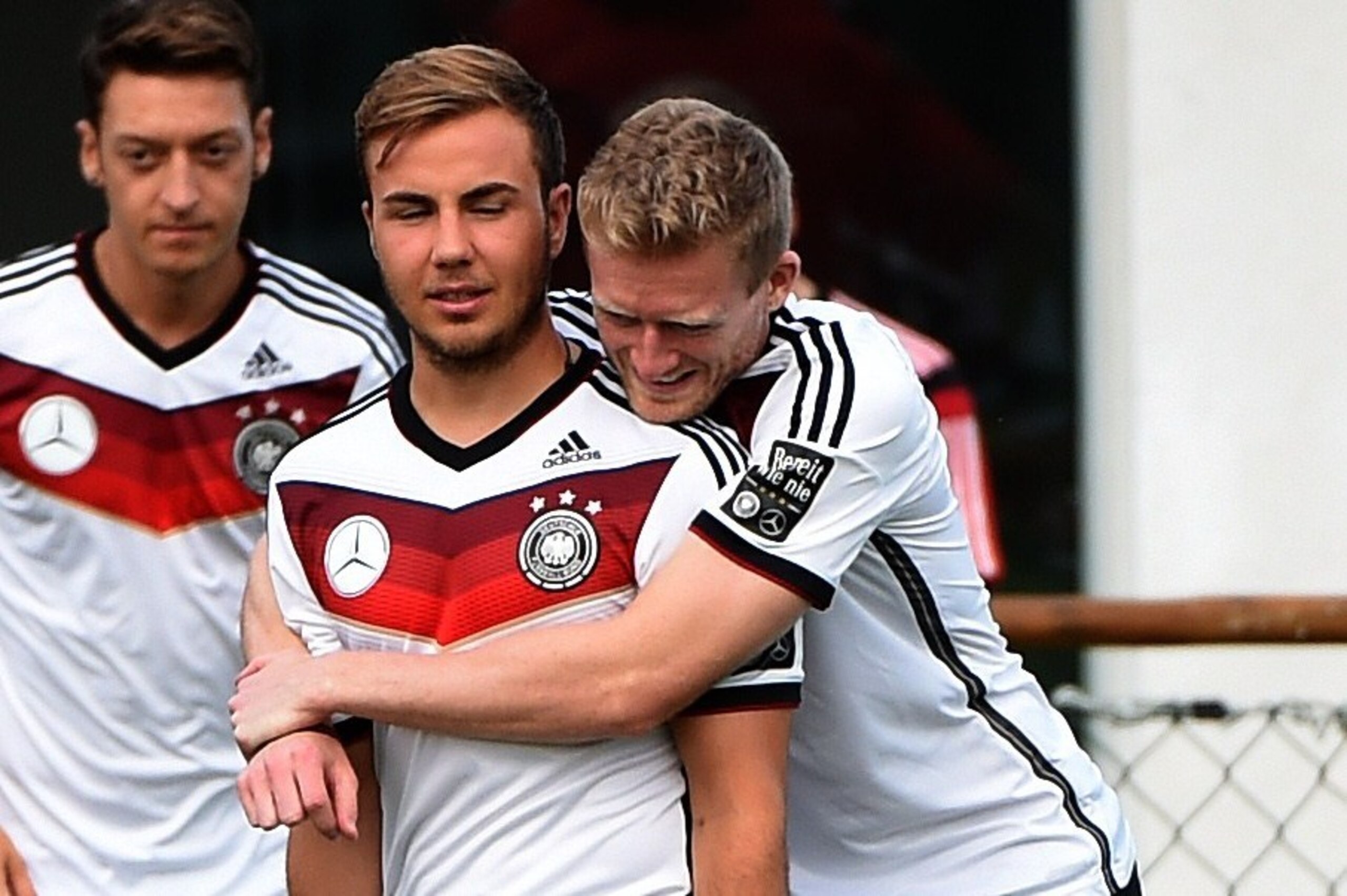 Germany's forward Andre Schuerrle (R) gives a hug to Germany's forward Mario Goetze during a training session in Santo Andre on July 10, 2014, ahead of the final match Argentina vs Germany on July 13, during the 2014 FIFA World Cup football tournament. AF