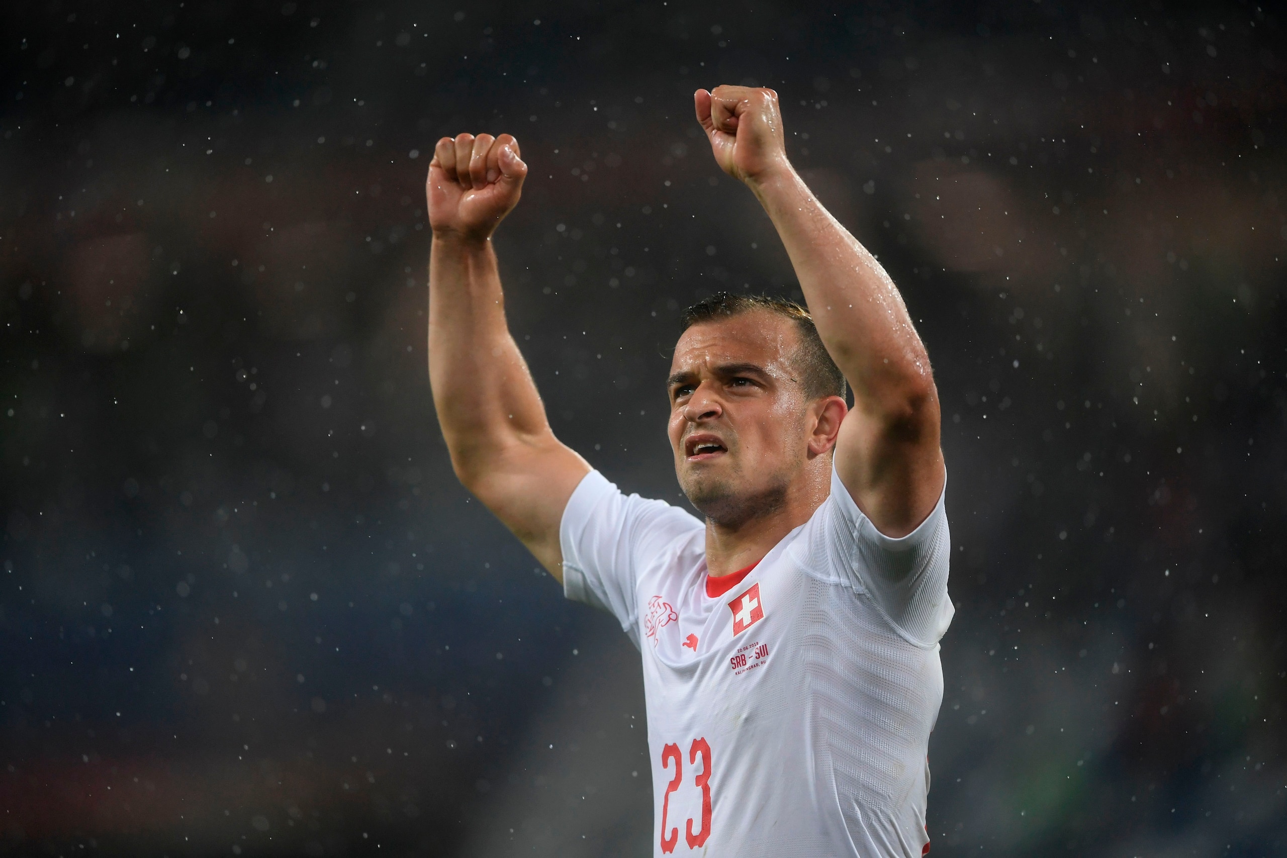 TOPSHOT - Switzerland's forward Xherdan Shaqiri celebrates winning their Russia 2018 World Cup Group E football match between Serbia and Switzerland at the Kaliningrad Stadium in Kaliningrad on June 22, 2018. (Photo by OZAN KOSE / AFP) / RESTRICTED TO EDI