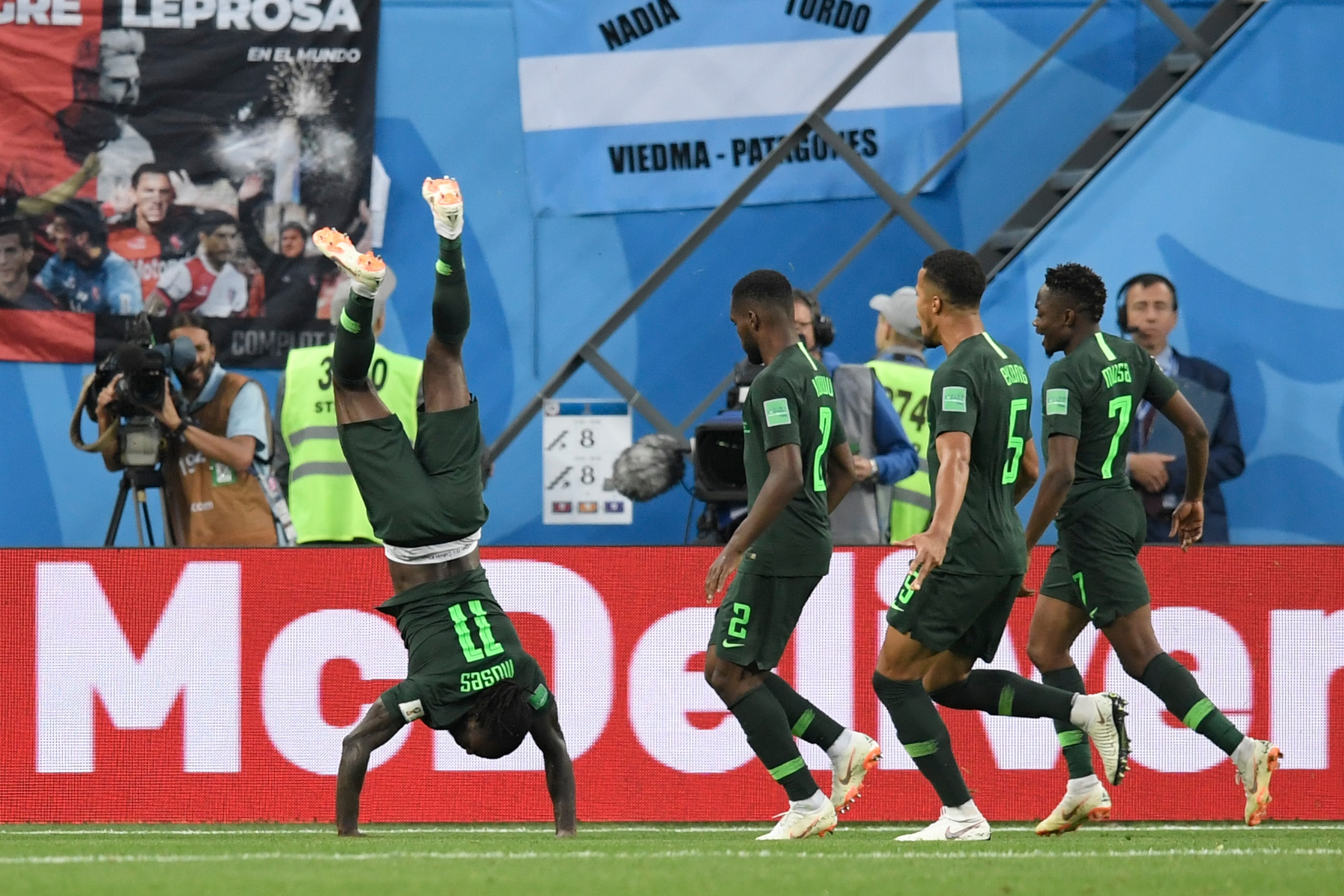 TOPSHOT - Nigeria's forward Victor Moses (L) celebrates his goal during the Russia 2018 World Cup Group D football match between Nigeria and Argentina at the Saint Petersburg Stadium in Saint Petersburg on June 26, 2018. (Photo by GABRIEL BOUYS / AFP) / R