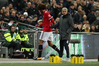 LONDON, ENGLAND - JANUARY 31: Jose Mourinho the head coach / manager of Manchester United with Marouane Fellaini of Manchester United as he is substituted during the Premier League match between Tottenham Hotspur and Manchester United at Wembley Stadium o