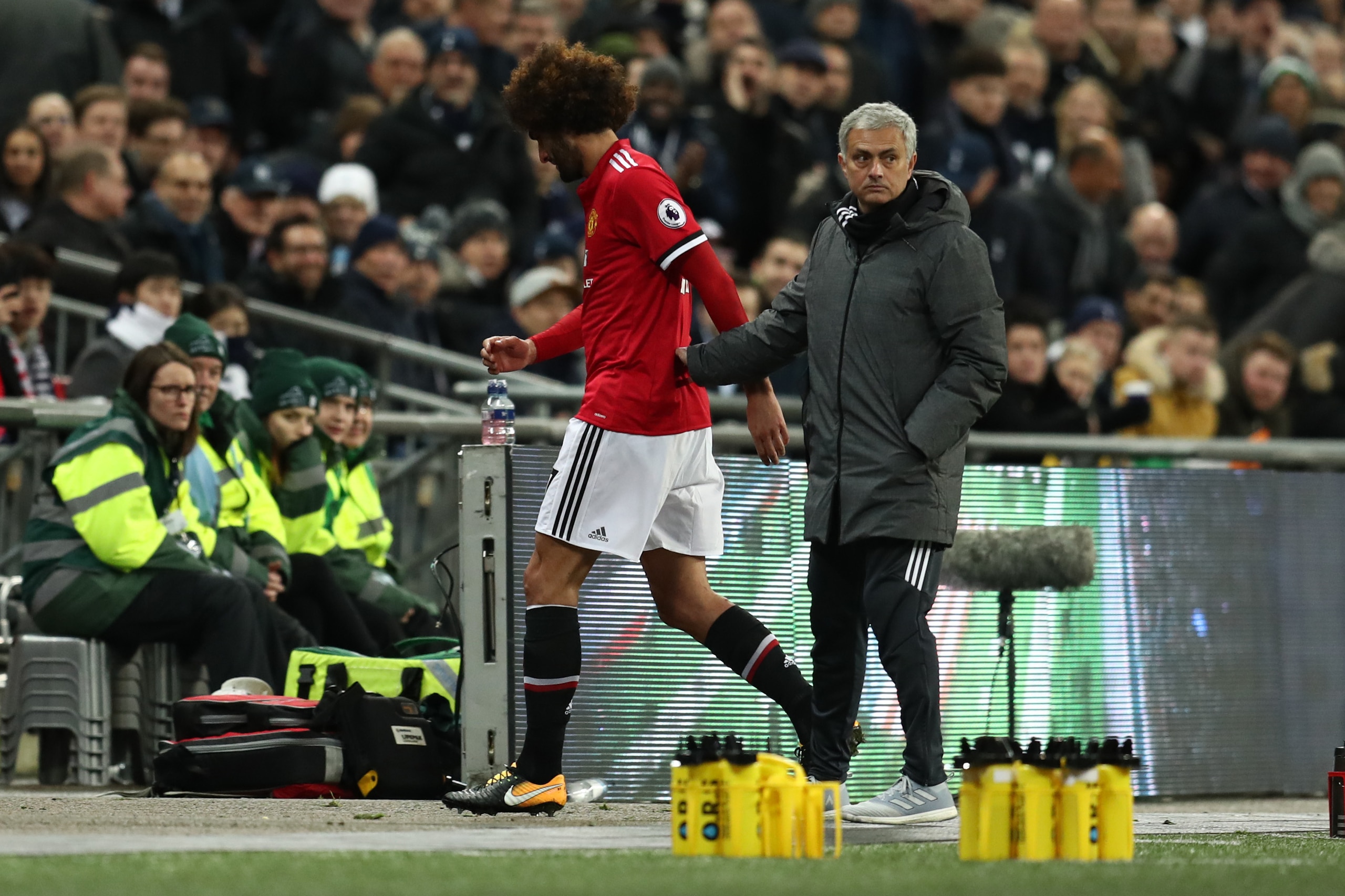 LONDON, ENGLAND - JANUARY 31: Jose Mourinho the head coach / manager of Manchester United with Marouane Fellaini of Manchester United as he is substituted during the Premier League match between Tottenham Hotspur and Manchester United at Wembley Stadium o