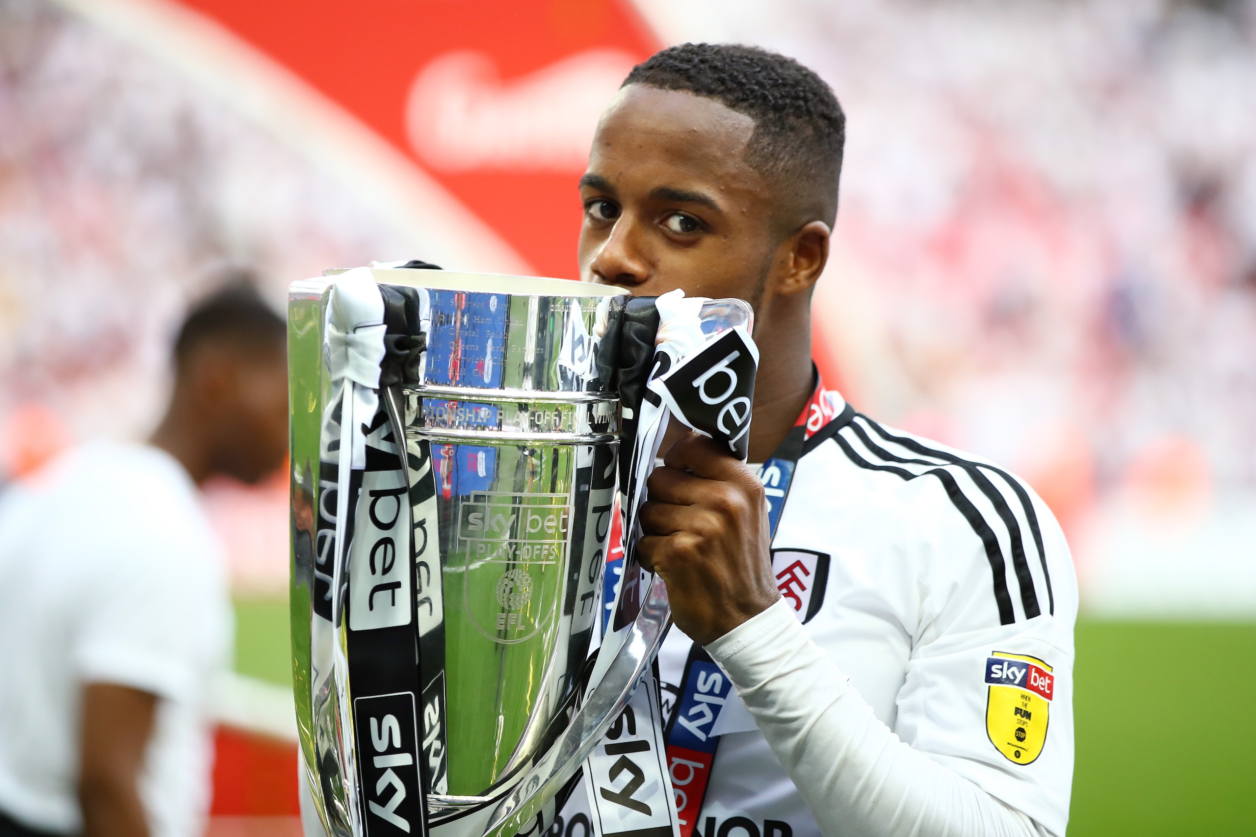 LONDON, ENGLAND - MAY 26:  Ryan Sessegnon of Fulham celebrates with the trophy following their sides victory in the Sky Bet Championship Play Off Final between Aston Villa and  Fulham at Wembley Stadium on May 26, 2018 in London, England.  (Photo by Clive