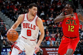 ATLANTA, GA - MARCH 11:  Zach LaVine #8 of the Chicago Bulls drives against Taurean Prince #12 of the Atlanta Hawks at Philips Arena on March 11, 2018 in Atlanta, Georgia.  NOTE TO USER: User expressly acknowledges and agrees that, by downloading and or u