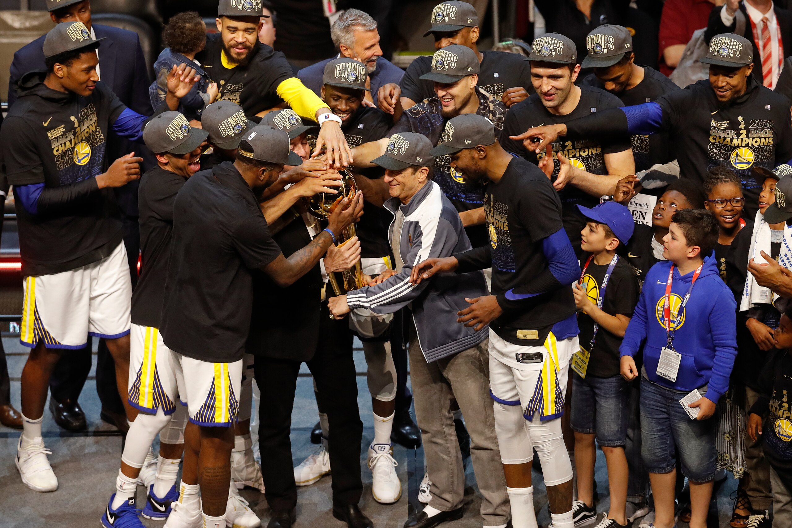CLEVELAND, OH - JUNE 8: The Golden State Warriors celebrate on stage with the Larry O'Brien Championship Trophy after winning Game Four of the 2018 NBA Finals against the Cleveland Cavaliers on June 8, 2018 at Quicken Loans Arena in Cleveland, Ohio. NOTE 
