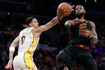 LOS ANGELES, CA - MARCH 11:  LeBron James #23 of the Cleveland Cavaliers attempts a layup agaist Kyle Kuzma #0 of the Los Angeles Lakers during the second quarter of the game at Staples Center on March 11, 2018 in Los Angeles, California.  NOTE TO USER: U