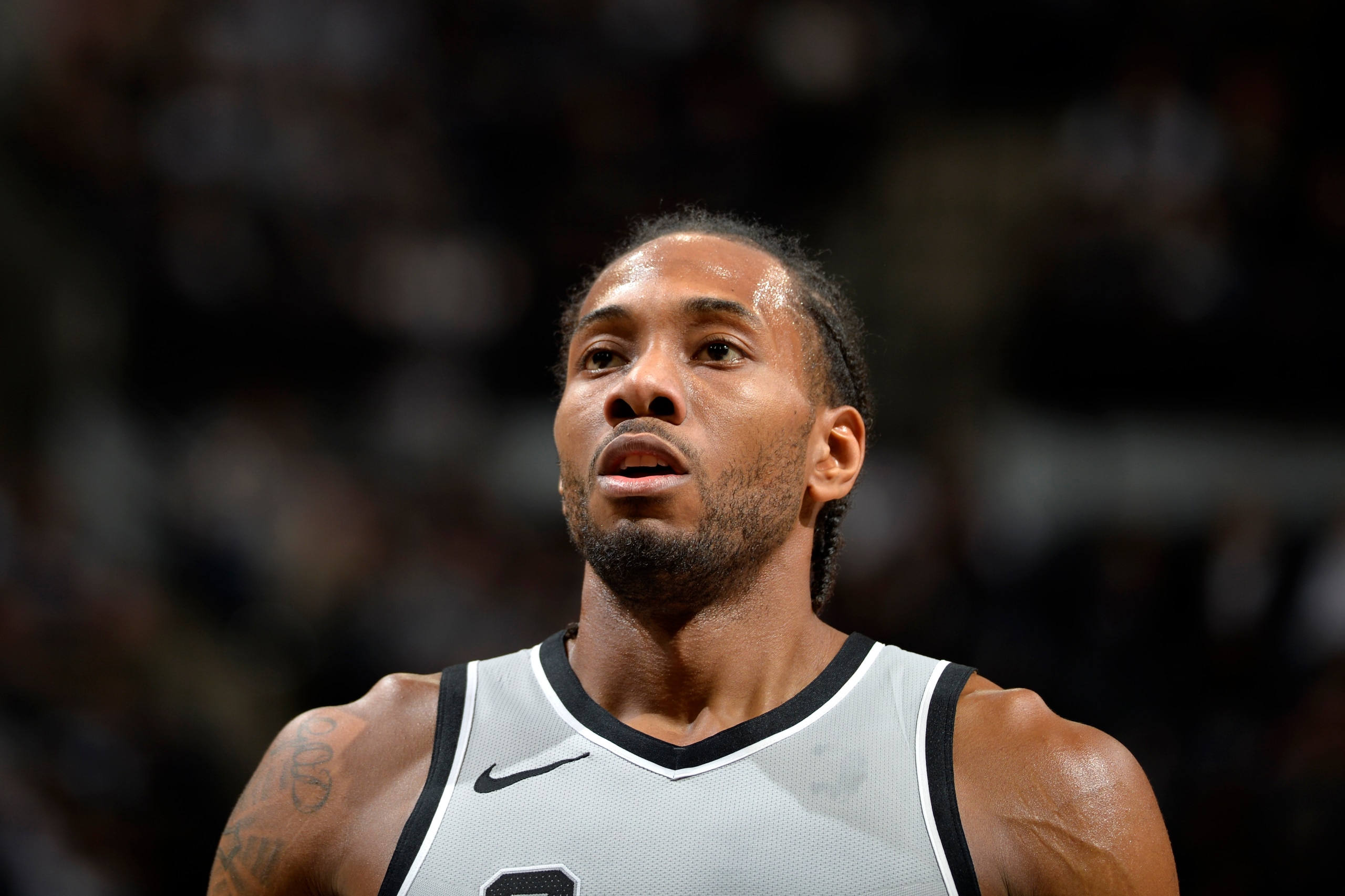 SAN ANTONIO, TX - JANUARY 13:  Kawhi Leonard #2 of the San Antonio Spurs looks on during the game against the Denver Nuggets on January 13, 2018 at the AT&T Center in San Antonio, Texas. NOTE TO USER: User expressly acknowledges and agrees that, by downlo
