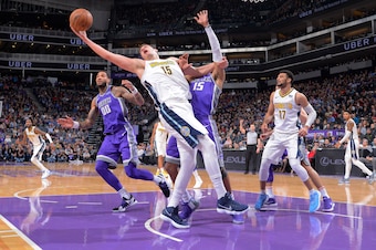 SACRAMENTO, CA - JANUARY 6: Nikola Jokic #15 of the Denver Nuggets rebounds against the Sacramento Kings on January 6, 2018 at Golden 1 Center in Sacramento, California. NOTE TO USER: User expressly acknowledges and agrees that, by downloading and or usin