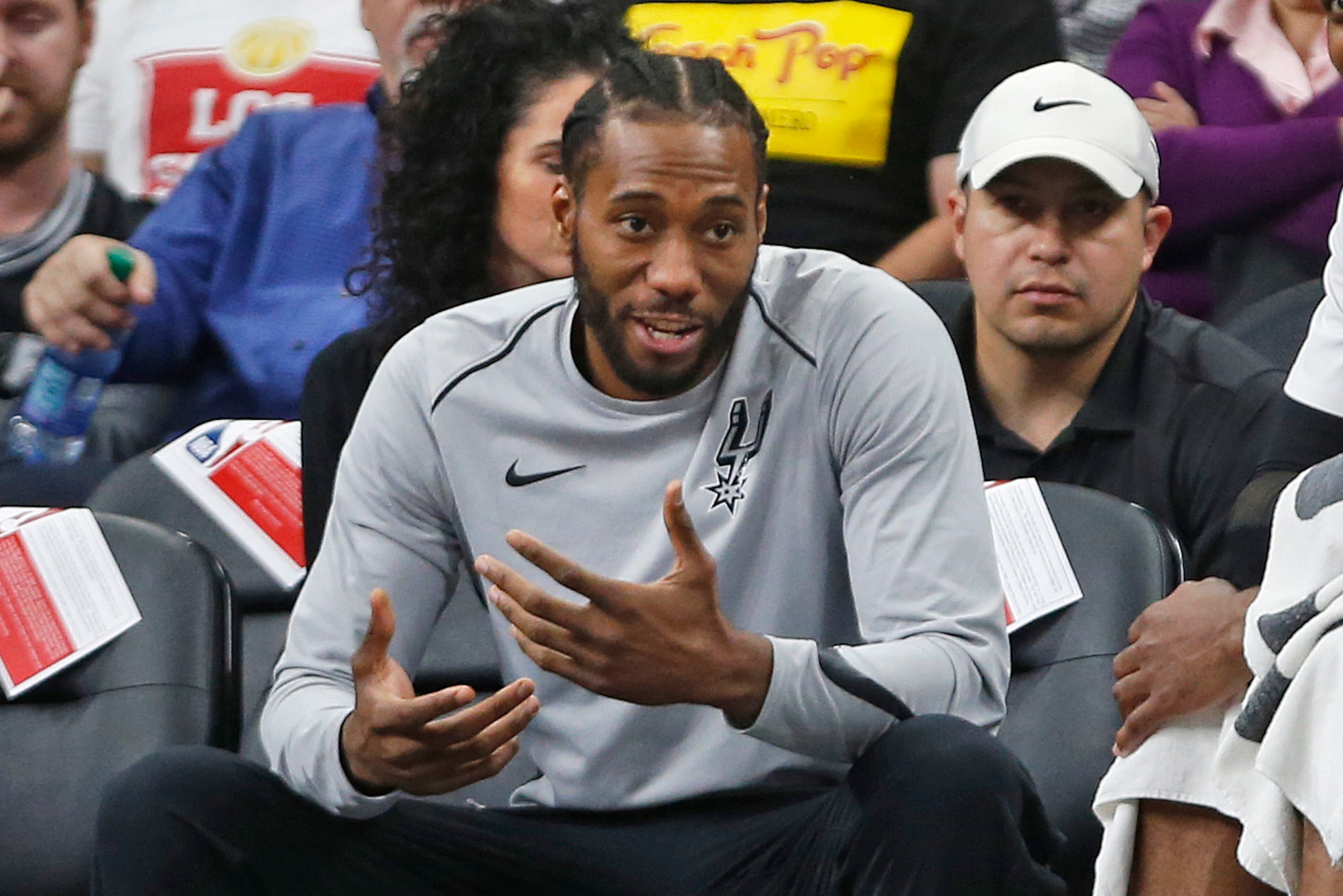 SAN ANTONIO,TX - MARCH 13 :  Kawhi Leonard #2 of the San Antonio Spurs still not playing talks with teammate LaMarcus Aldridge #12 of the San Antonio Spurs during game against the Orlando Magic at AT&T Center on March 13, 2018  in San Antonio, Texas.  NOT