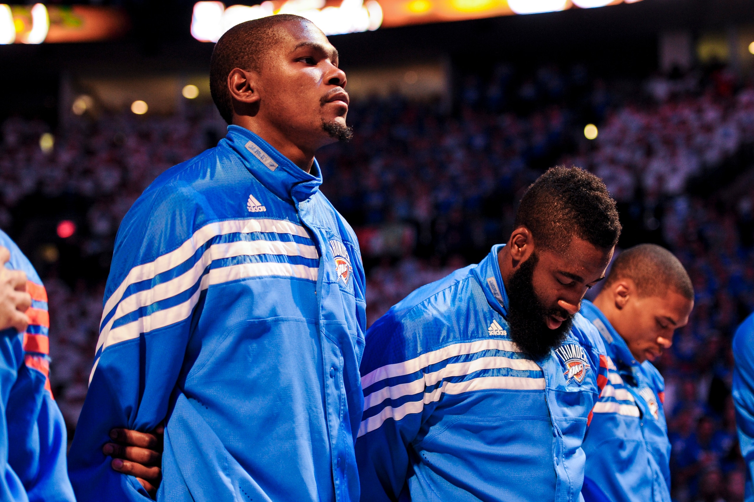 OKLAHOMA CITY, OK - JUNE 14: Kevin Durant #35, James Harden #13 and Russell Westbrook #0 of the Oklahoma City Thunder listen to the National Anthem before facing the Miami Heat in Game Two of the 2012 NBA Finals at Chesapeake Energy Arena on June 14, 2012
