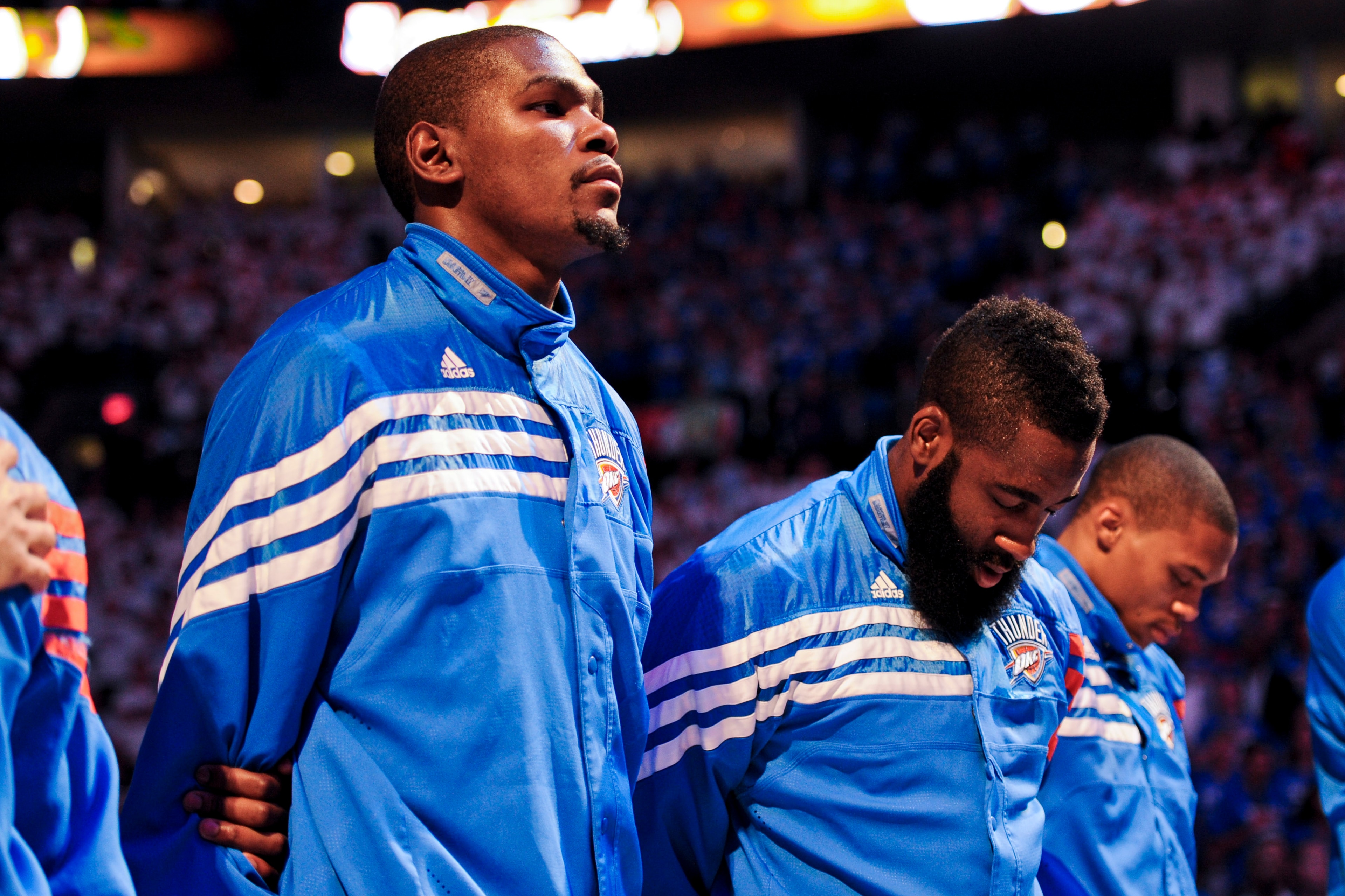 OKLAHOMA CITY, OK - JUNE 14: Kevin Durant #35, James Harden #13 and Russell Westbrook #0 of the Oklahoma City Thunder listen to the National Anthem before facing the Miami Heat in Game Two of the 2012 NBA Finals at Chesapeake Energy Arena on June 14, 2012