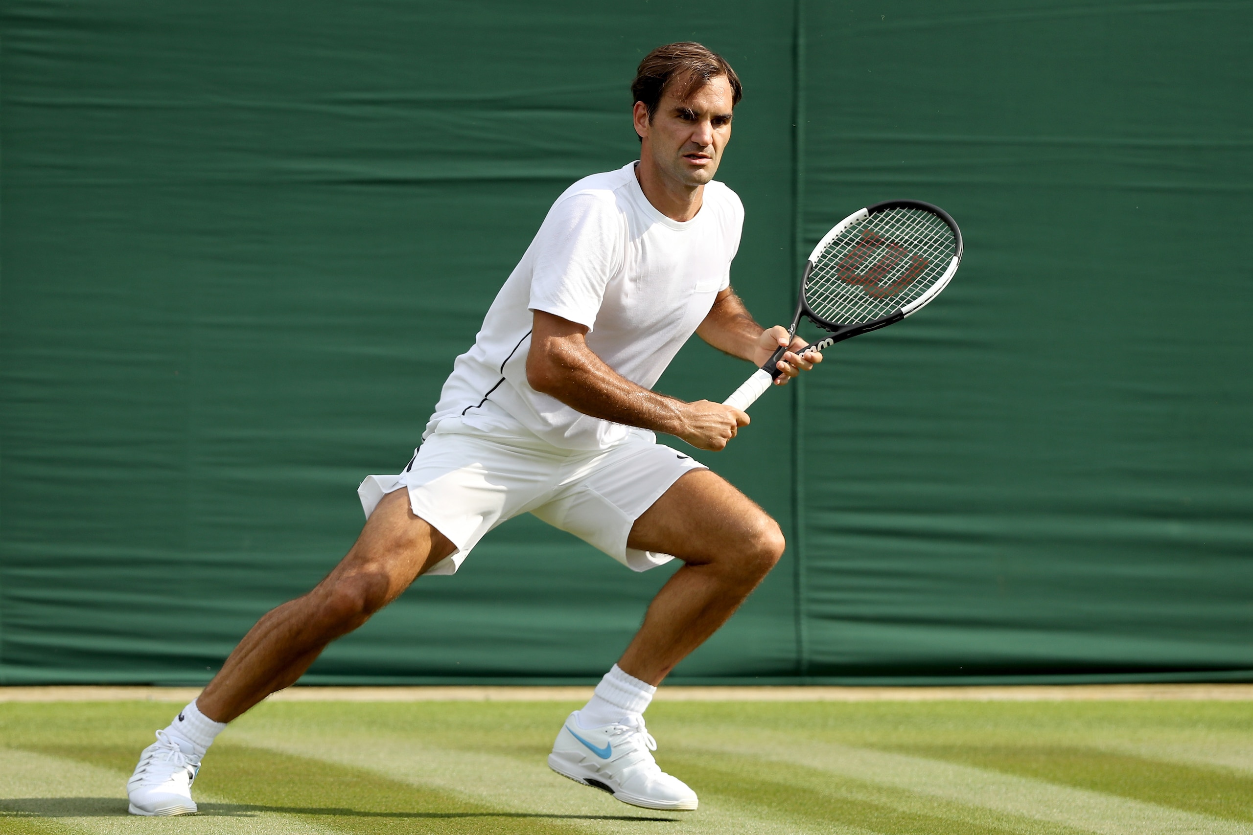 LONDON, ENGLAND - JUNE 28:  Roger Federer of Switzerland practices on court during training for the Wimbledon Lawn Tennis Championships at the All England Lawn Tennis and Croquet Club at Wimbledon on June 28, 2018 in London, England.  (Photo by Matthew St