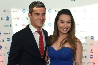Liverpool's Brazilian midfielder Philippe Coutinho an his wife Aine arrive to attend the Liverpool Football Club 2015 Players' Awards at the Echo Arena in Liverpool on May 19, 2015. AFP PHOTO / PAUL ELLIS        (Photo credit should read PAUL ELLIS/AFP/Ge
