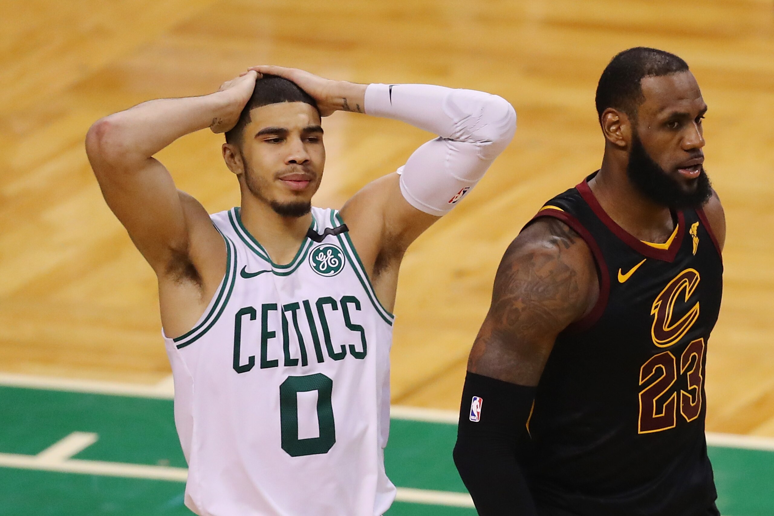 BOSTON, MA - MAY 27:  Jayson Tatum #0 of the Boston Celtics reacts as he stands next to LeBron James #23 of the Cleveland Cavaliers in the second half during Game Seven of the 2018 NBA Eastern Conference Finals at TD Garden on May 27, 2018 in Boston, Mass