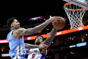 LOS ANGELES, CA - APRIL 13:  Wilson Chandler #21 of the Denver Nuggets has his shot blocked by DeAndre Jordan #6 of the Los Angeles Clippers during the first half at Staples Center on April 13, 2015 in Los Angeles, California.  NOTE TO USER: User expressl
