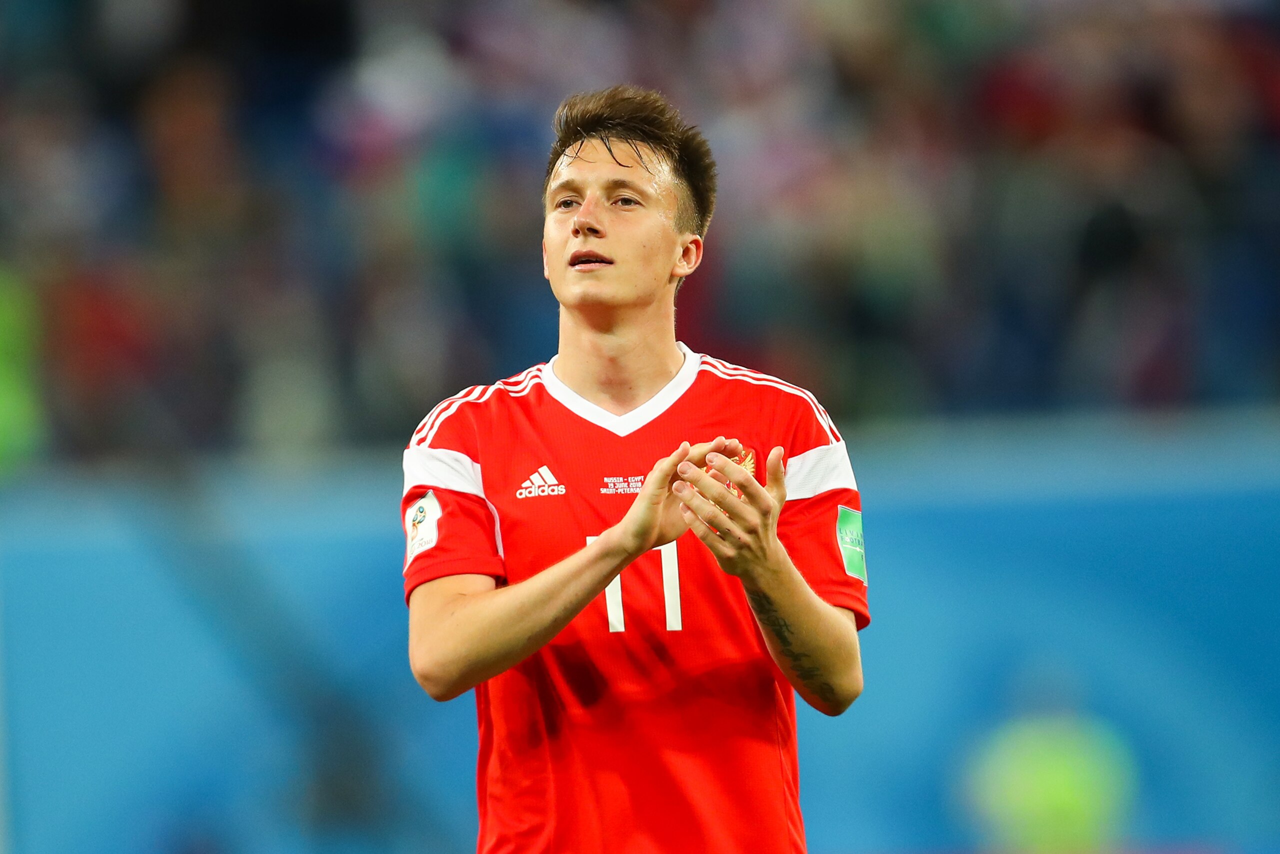 SAINT PETERSBURG, RUSSIA - JUNE 19:   Aleksandr Golovin of Russia applauds at the end of during the 2018 FIFA World Cup Russia group A match between Russia and Egypt at Saint Petersburg Stadium on June 19, 2018 in Saint Petersburg, Russia. (Photo by Robbi