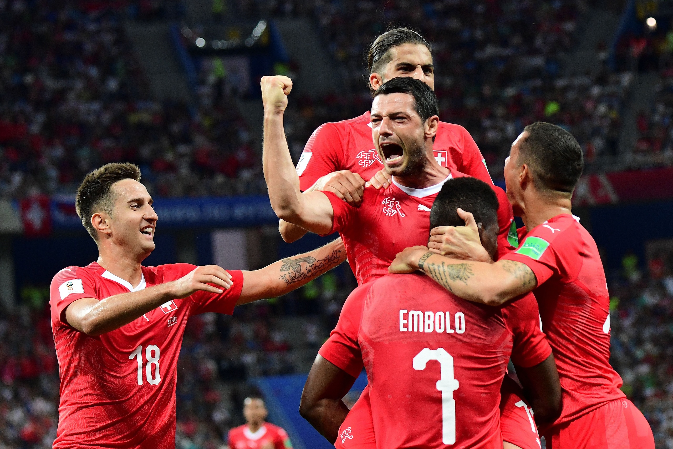 TOPSHOT - Switzerland's midfielder Blerim Dzemaili (C) celebrates after scoring the opening goal during the Russia 2018 World Cup Group E football match between Switzerland and Costa Rica at the Nizhny Novgorod Stadium in Nizhny Novgorod on June 27, 2018.