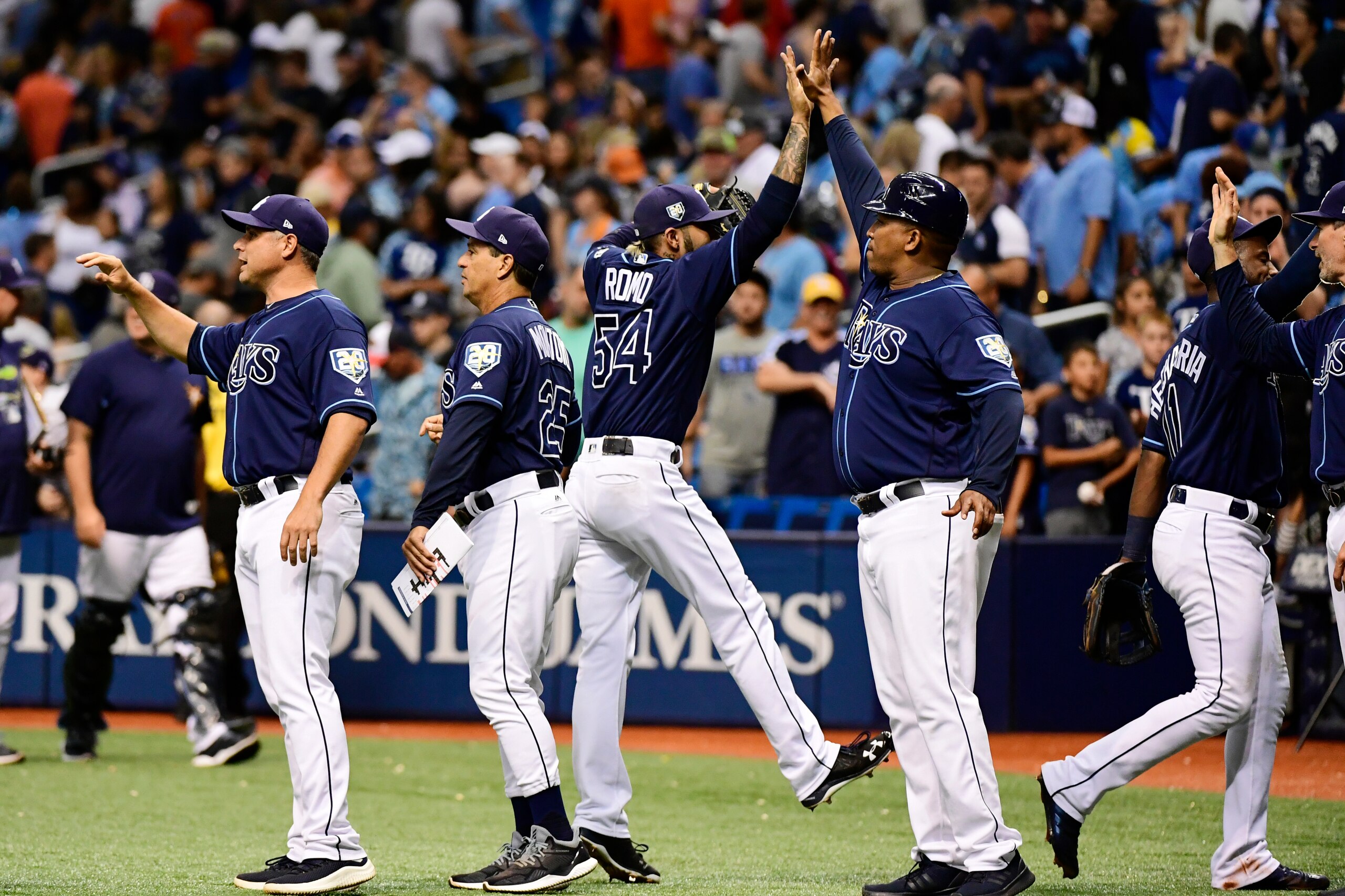 ST PETERSBURG, FL - JUNE 30: Sergio Romo #54 of the Tampa Bay Rays celebrates with first base coach Ozzie Timmons #30 after a 5-2 win against the Houston Astros on June 30, 2018 at  Tropicana Field in St Petersburg, Florida. (Photo by Julio Aguilar/Getty 