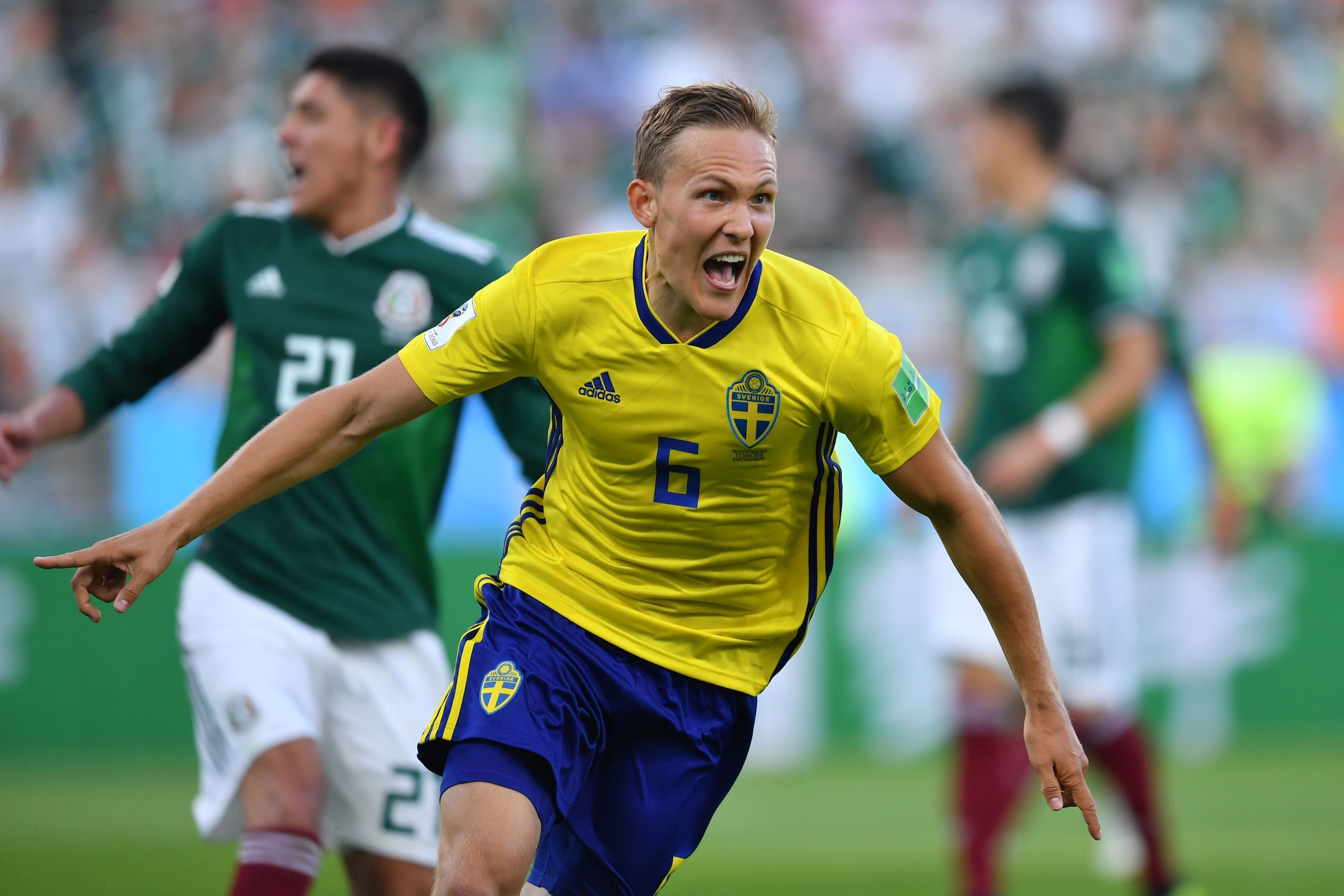 Sweden's defender Ludwig Augustinsson celebrates after scoring the opening goal during the Russia 2018 World Cup Group F football match between Mexico and Sweden at the Ekaterinburg Arena in Ekaterinburg on June 27, 2018. (Photo by HECTOR RETAMAL / AFP) /