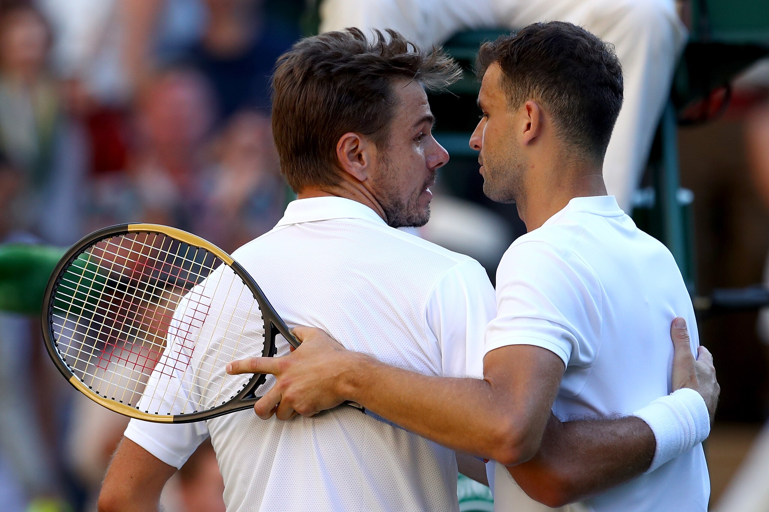 LONDON, ENGLAND - JULY 02: Stanislas Wawrinka of Switzerland (L) shakes hands with Grigor Dimitrov of Bulgaria after their Men's Singles first round match on day one of the Wimbledon Lawn Tennis Championships at All England Lawn Tennis and Croquet Club o LONDON, ENGLAND - JULY 02: Stanislas Wawrinka of Switzerland (L) shakes hands with Grigor Dimitrov of Bulgaria after their Men's Singles first round match on day one of the Wimbledon Lawn Tennis Championships at All England Lawn Tennis and Croquet Club o