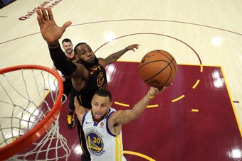 CLEVELAND, OH - JUNE 06:  Stephen Curry #30 of the Golden State Warriors attempts a layup defended by LeBron James #23 of the Cleveland Cavaliers in the third quarter during Game Three of the 2018 NBA Finals at Quicken Loans Arena on June 6, 2018 in Cleve