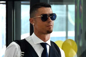 Portugal's forward Cristiano Ronaldo arrives at the Zhukovsky airport, about 40 km southeast of Moscow, on July 1, 2018, as Portugal's team departs following their loss the previous day to Uruguay in their Russia 2018 World Cup round of 16 football match.