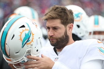 BUFFALO, NY - DECEMBER 17: Jay Cutler #6 of the Miami Dolphins prepares to put on his helmet during NFL game action against the Buffalo Bills at New Era Field on December 17, 2017 in Buffalo, New York. (Photo by Tom Szczerbowski/Getty Images)