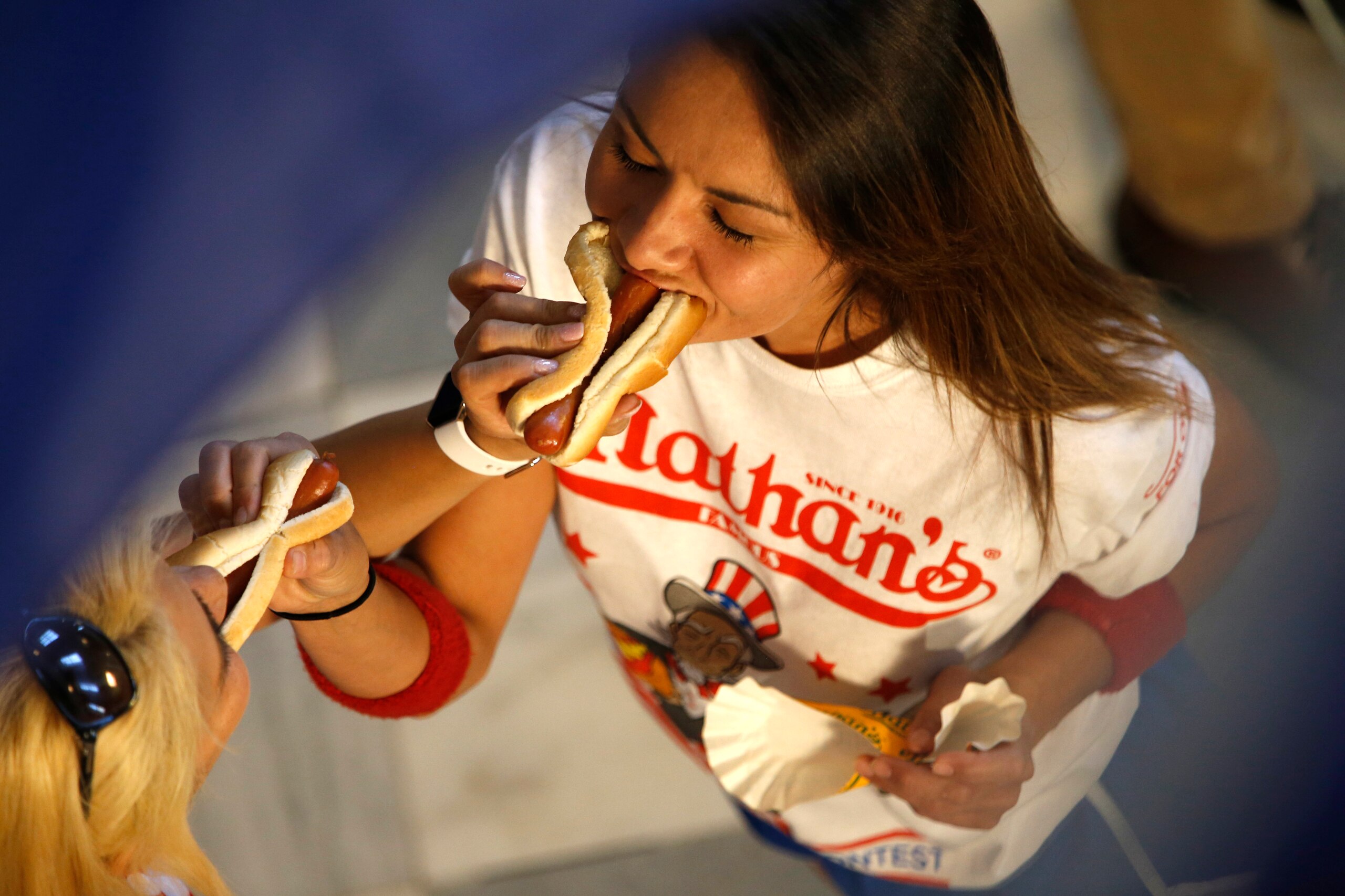 Despite the friendly nature of this shot, it's a dog-eat-dog battle on Coney Island.