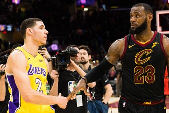 CLEVELAND, OH - DECEMBER 14: Lonzo Ball #2 of the Los Angeles Lakers shakes hands with LeBron James #23 of the Cleveland Cavaliers after the game at Quicken Loans Arena on December 14, 2017 in Cleveland, Ohio. The Cavaliers defeated the Lakers 121-112. NO