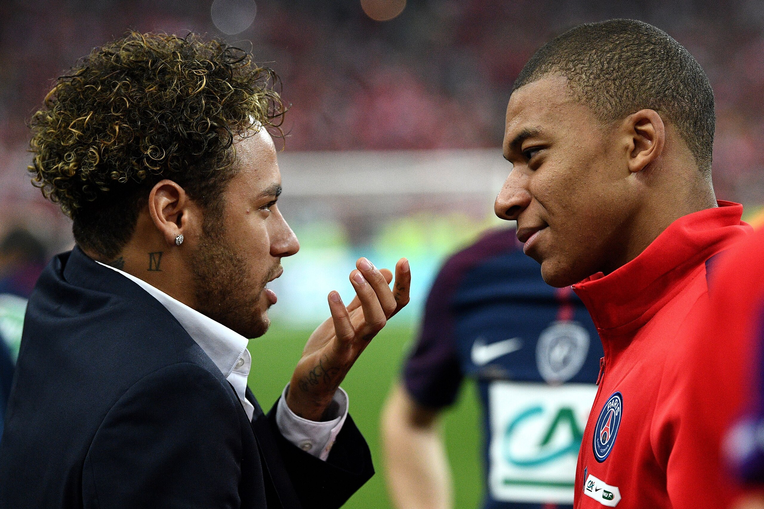 Paris Saint-Germain's Brazilian forward Neymar (L) speaks with Paris Saint-Germain's French forward Kylian MBappe at the end of the French Cup final football match between Les Herbiers and Paris Saint-Germain (PSG), on May 8, 2018 at the Stade de France i