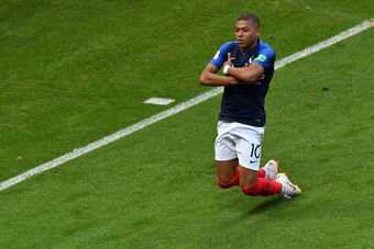 TOPSHOT - France's Kylian Mbappe celebrates after scoring his team's third goal during the Russia 2018 World Cup round of 16 football match between France and Argentina at the Kazan Arena in Kazan on June 30, 2018. (Photo by SAEED KHAN / AFP) / RESTRICTED